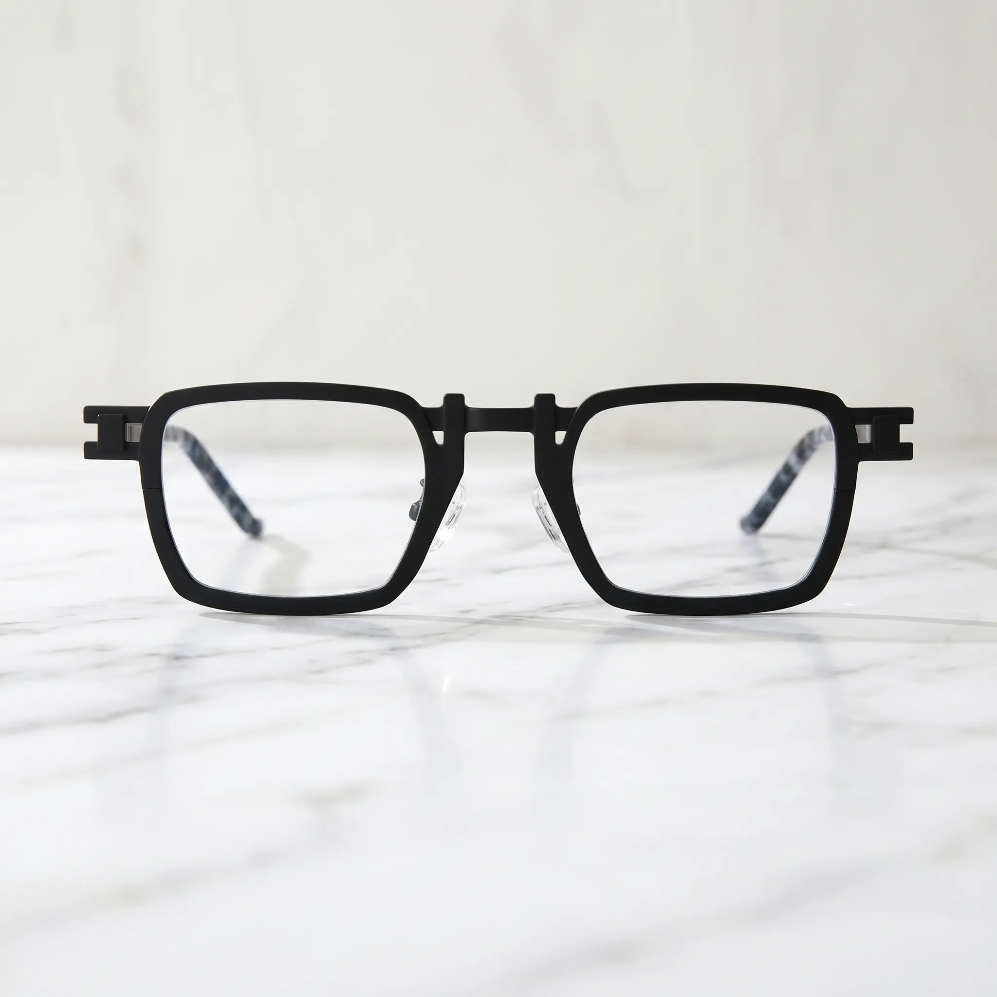 Barledear Onyx Smoke Marble eyeglasses shown in a clean lifestyle front view with black square frame and smoke marble temple detail
