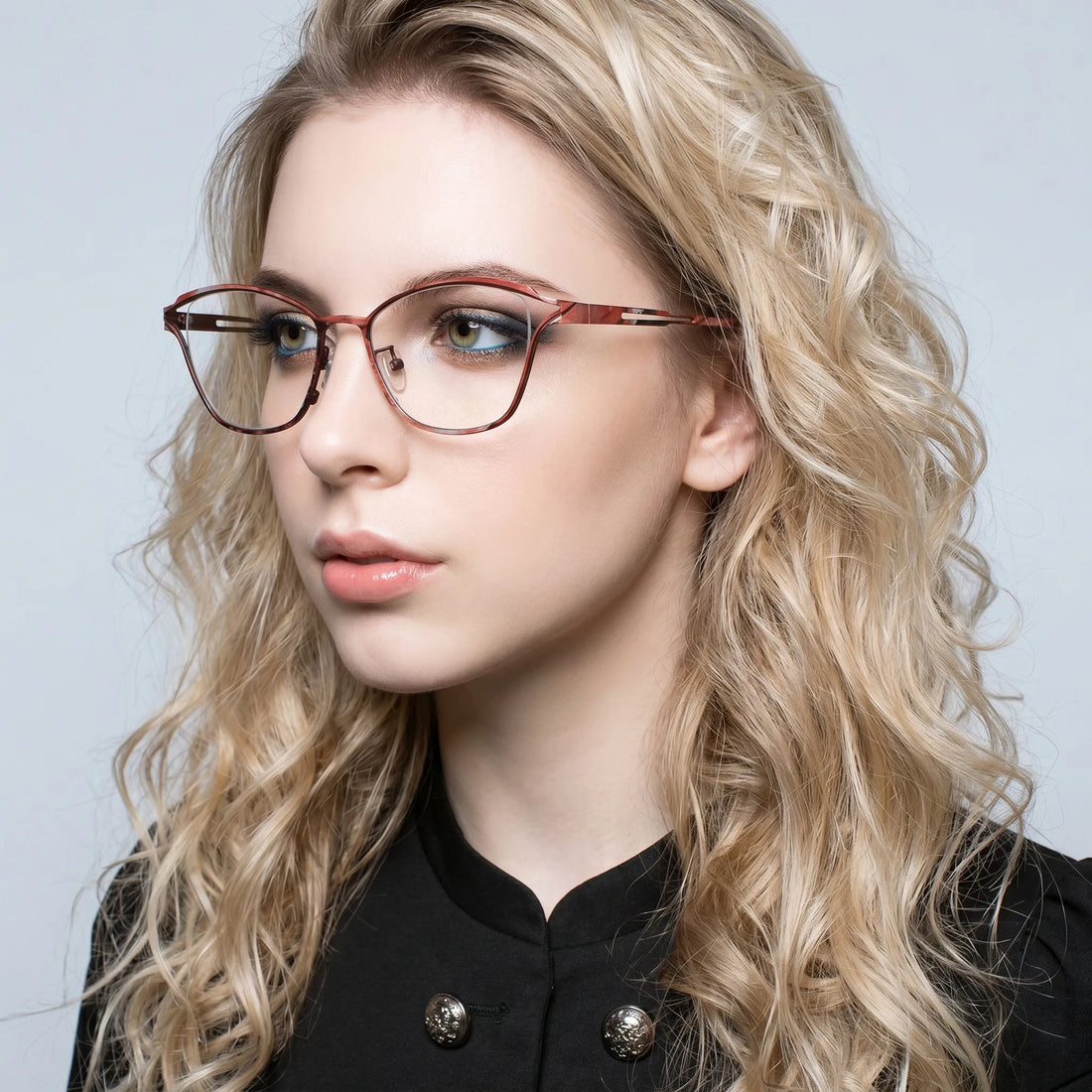 Model wearing Barledear Rosewood Amber eyeglasses in a lifestyle portrait showing lightweight butterfly cat-eye styling