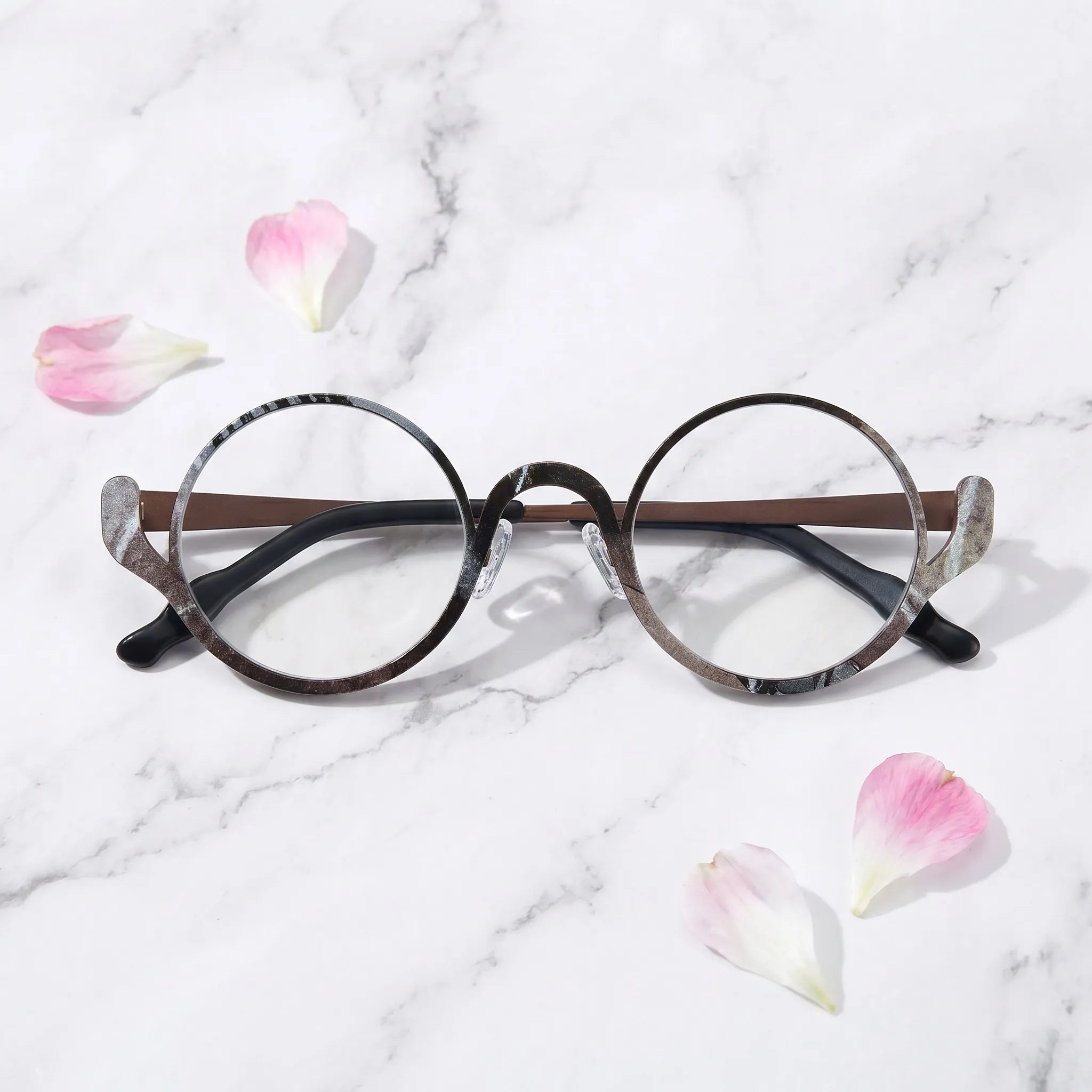 Barledear Smoky Cocoa eyeglasses folded display showing the round frame shape, slim temples, and artistic color-spliced pure titanium construction