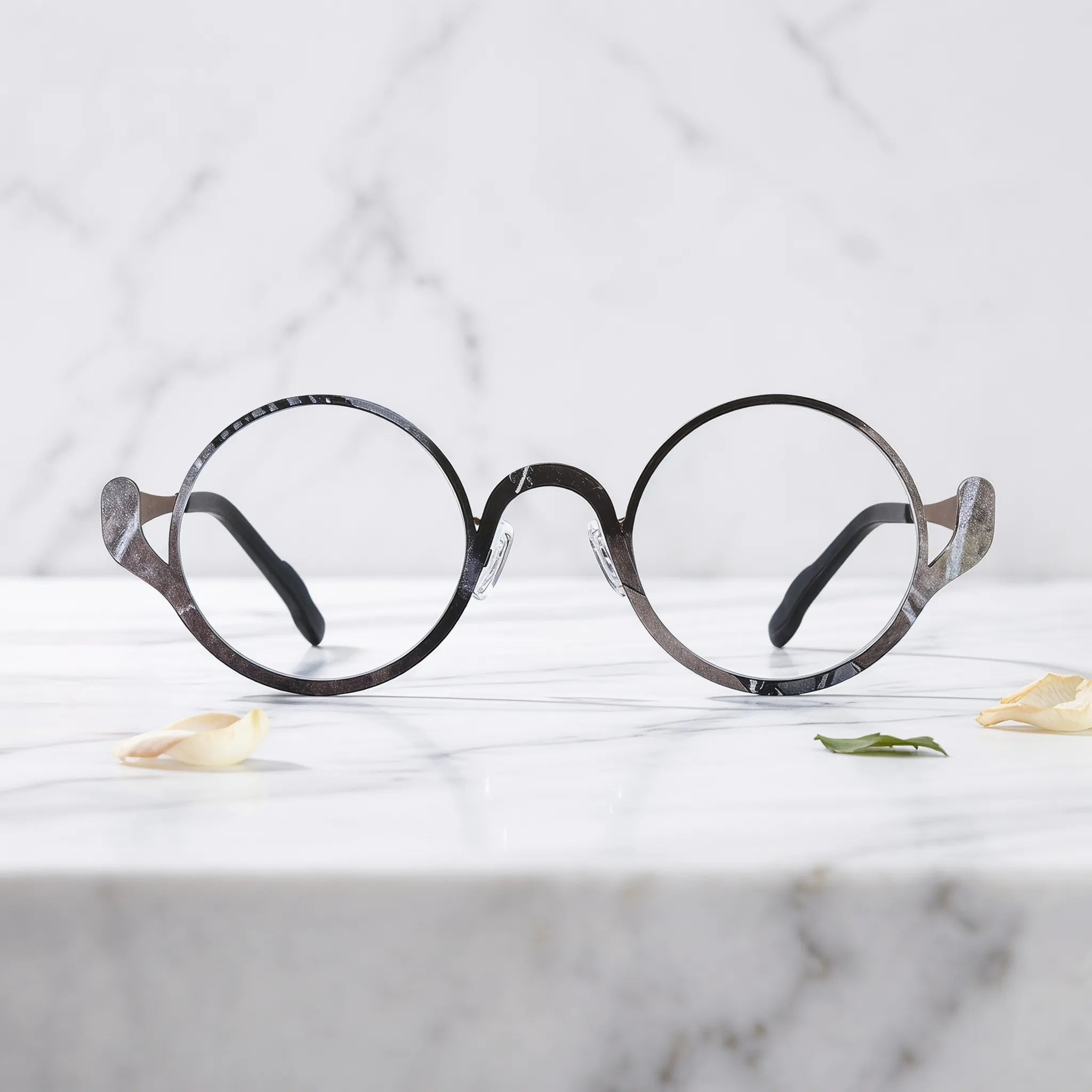 Barledear Smoky Cocoa eyeglasses shown in a clean lifestyle front view highlighting the artistic round pure titanium frame and modern everyday style