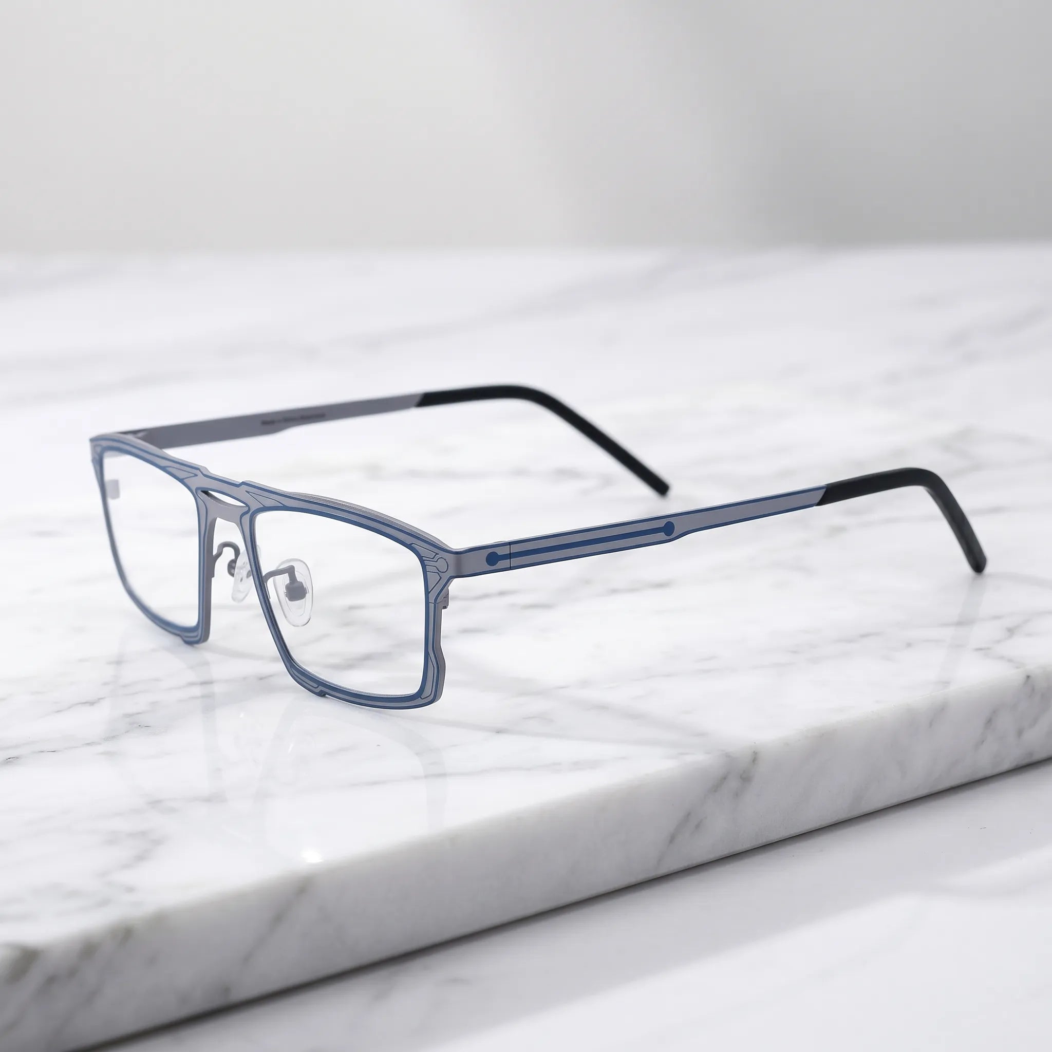 Barledear Graphite Noir eyeglasses angled side view showing slim dual-tone temples, bridge detail, and adjustable nose pads