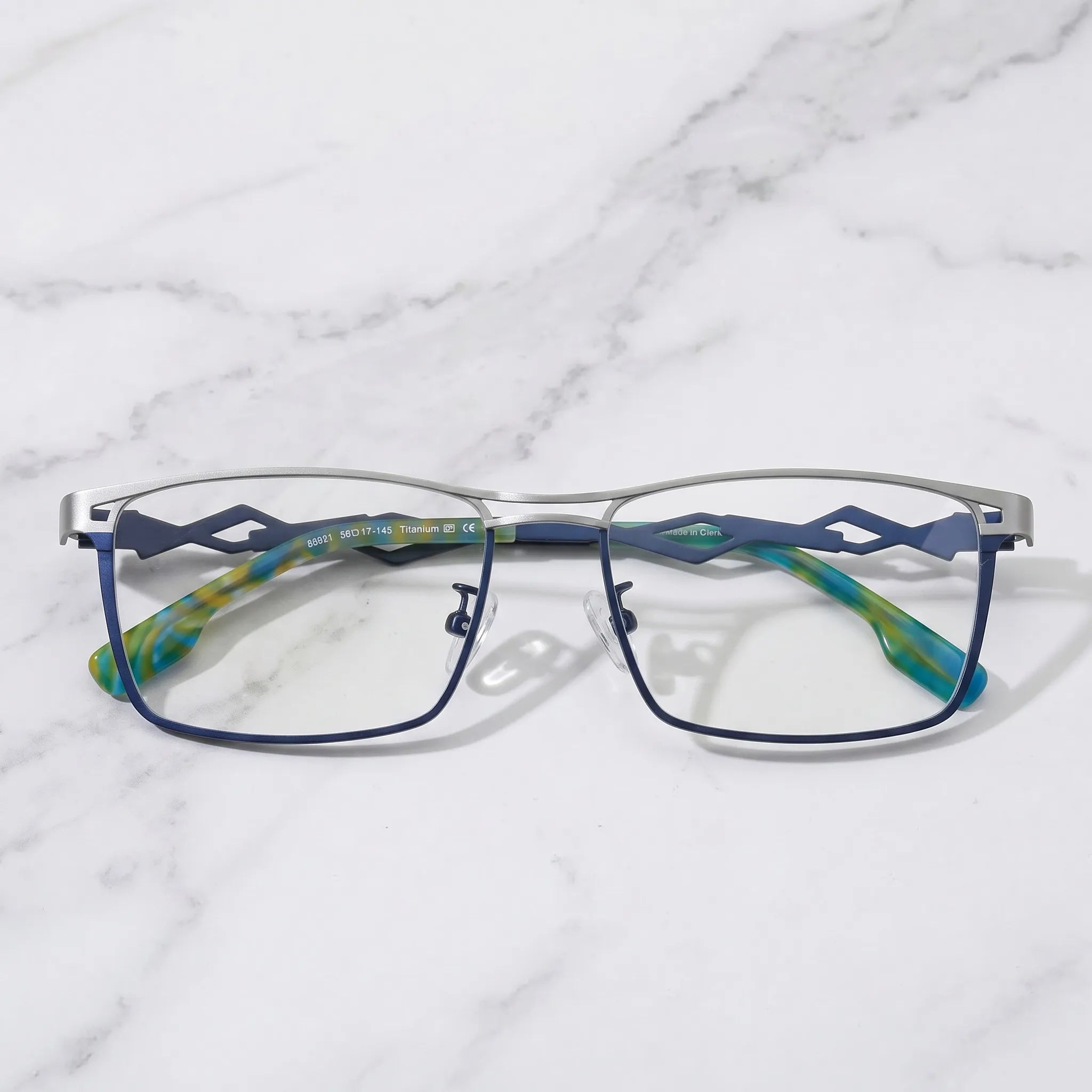 Barledear Titan Sky Blue eyeglasses folded display showing lightweight titanium frame and patterned temple tips