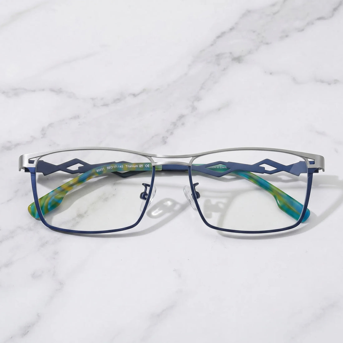 Barledear Titan Sky Blue eyeglasses folded display showing lightweight titanium frame and patterned temple tips
