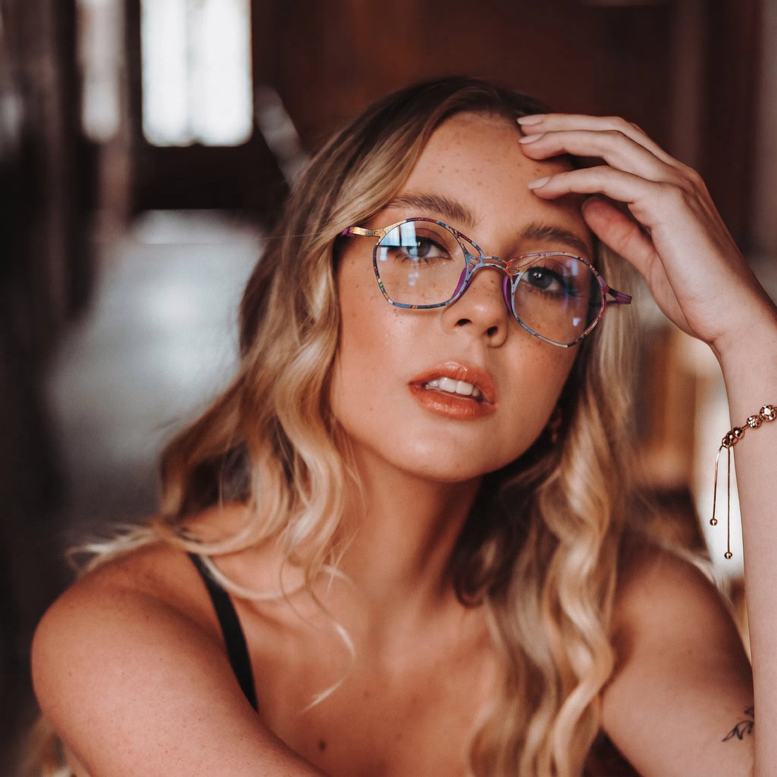 Model wearing Barledear Violet Aura Purple eyeglasses in a lifestyle portrait