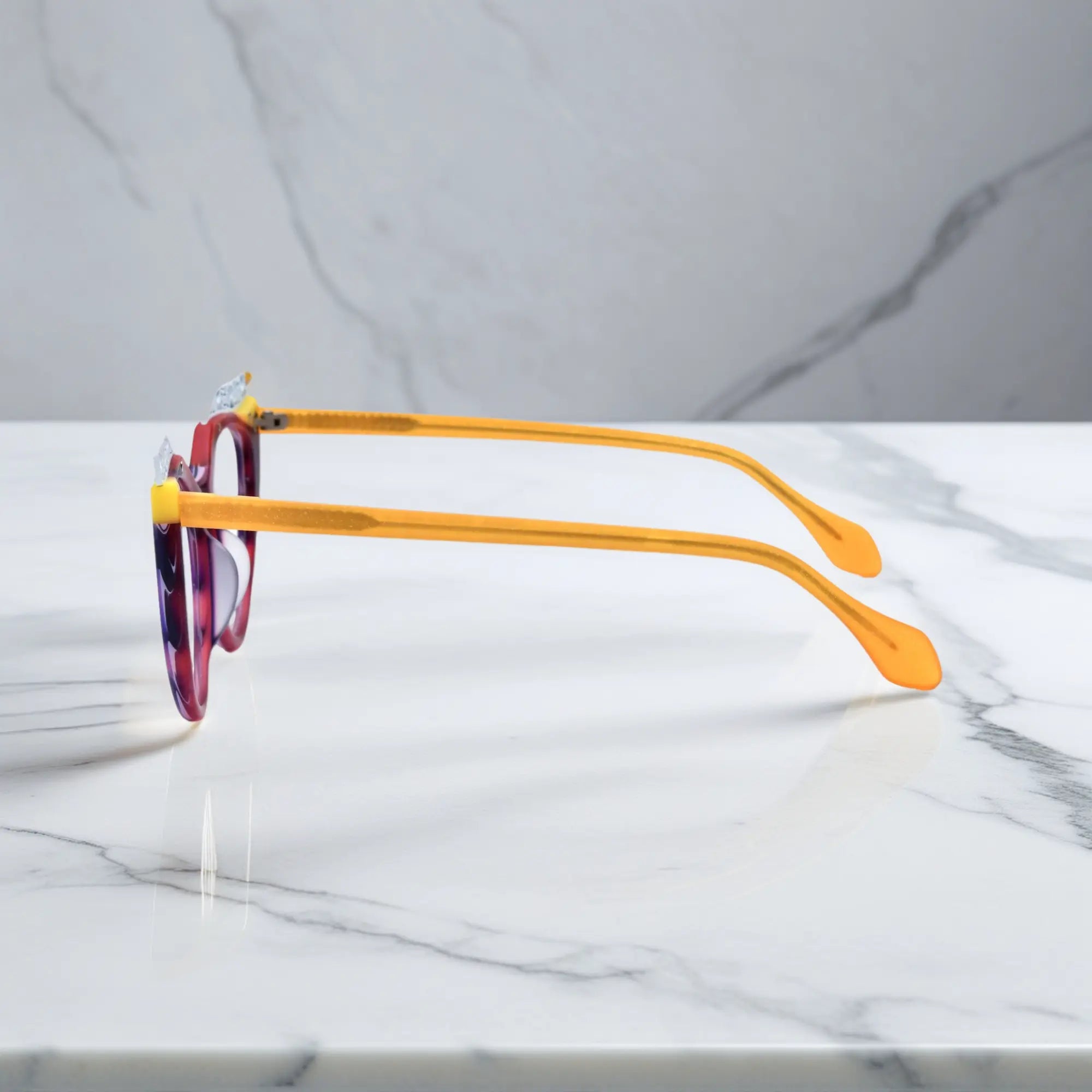 Side View of VoyueLens™ Amethyst Sunrise cat-eye eyeglasses with purple-to-yellow gradient and signature lace-pattern design.showing temples