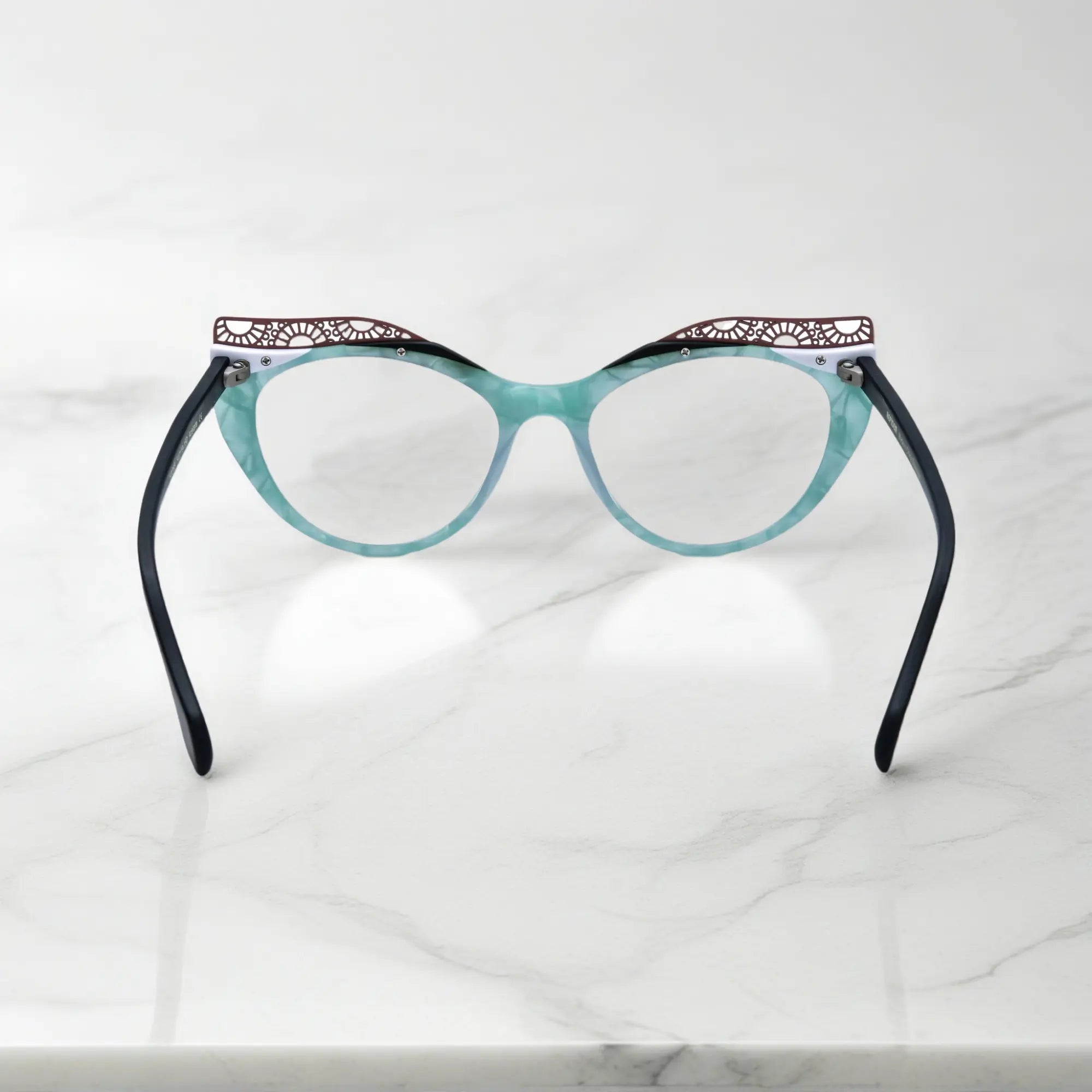 Back View of VoyueLens™ Aqua Frost cat-eye eyeglasses with blue-green gradient and signature lace-pattern design.