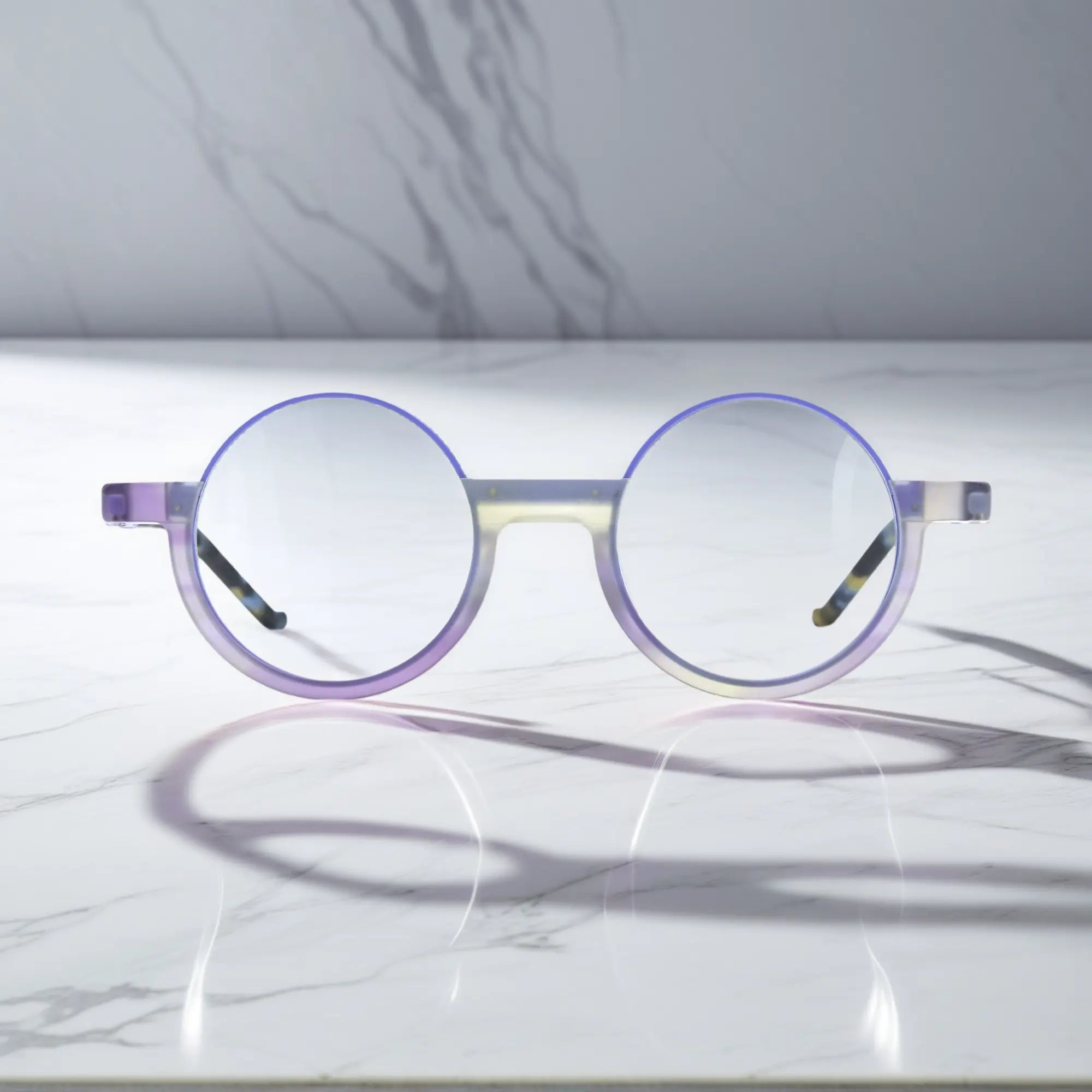 Front-facing view of VoyueLens™ Aurora Fade eyeglasses featuring a soft matte purple gradient and artistic round silhouette for expressive styling.