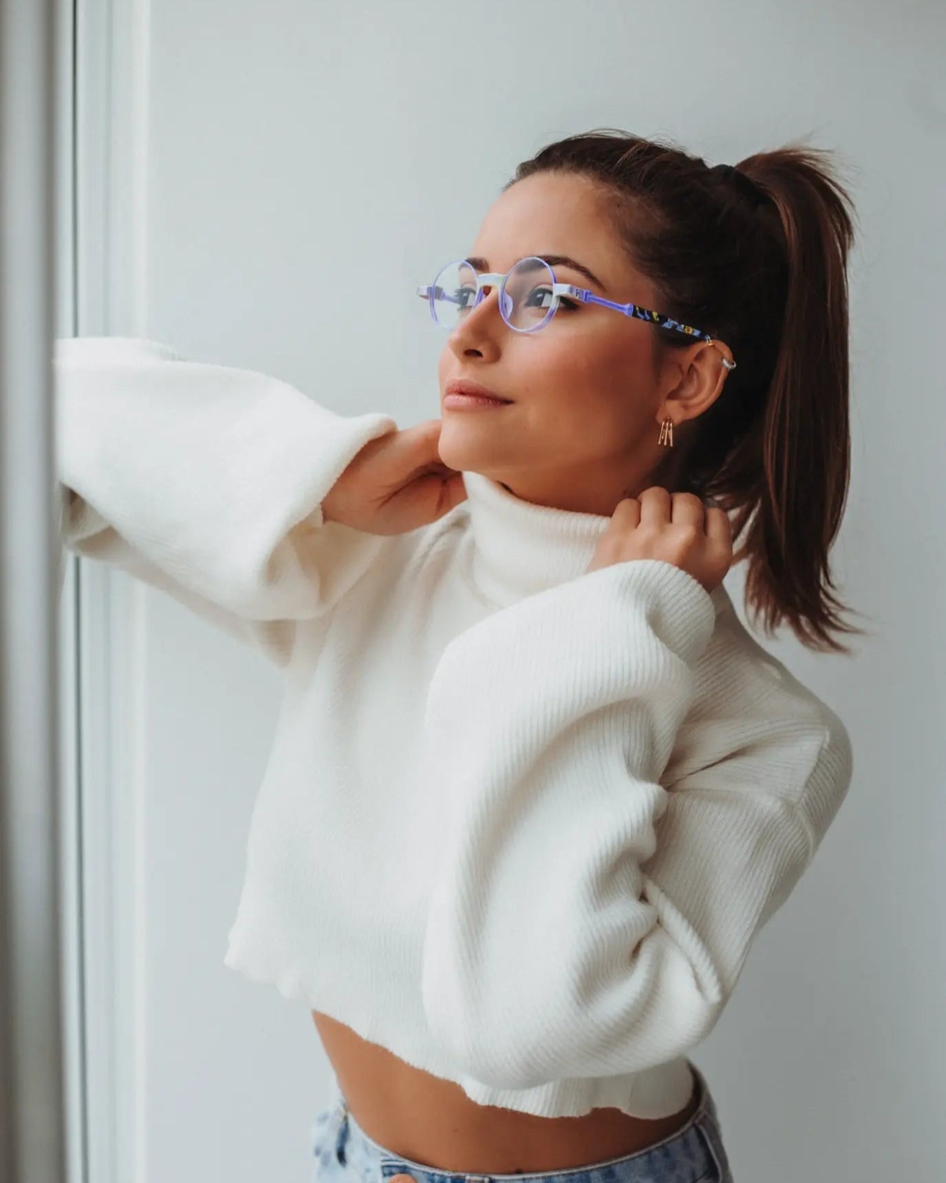 Model wearing Aurora Fade round eyeglasses with a matte purple finish, ideal for artistic and elegant looks.