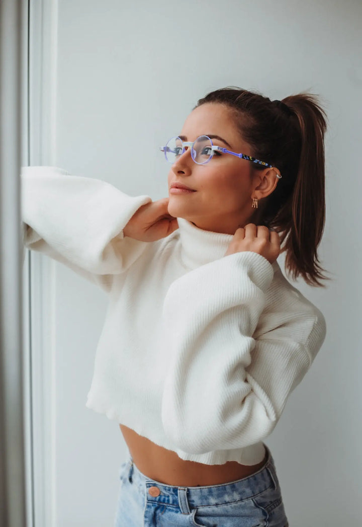 Model wearing Aurora Fade round eyeglasses with a matte purple finish, ideal for artistic and elegant looks.