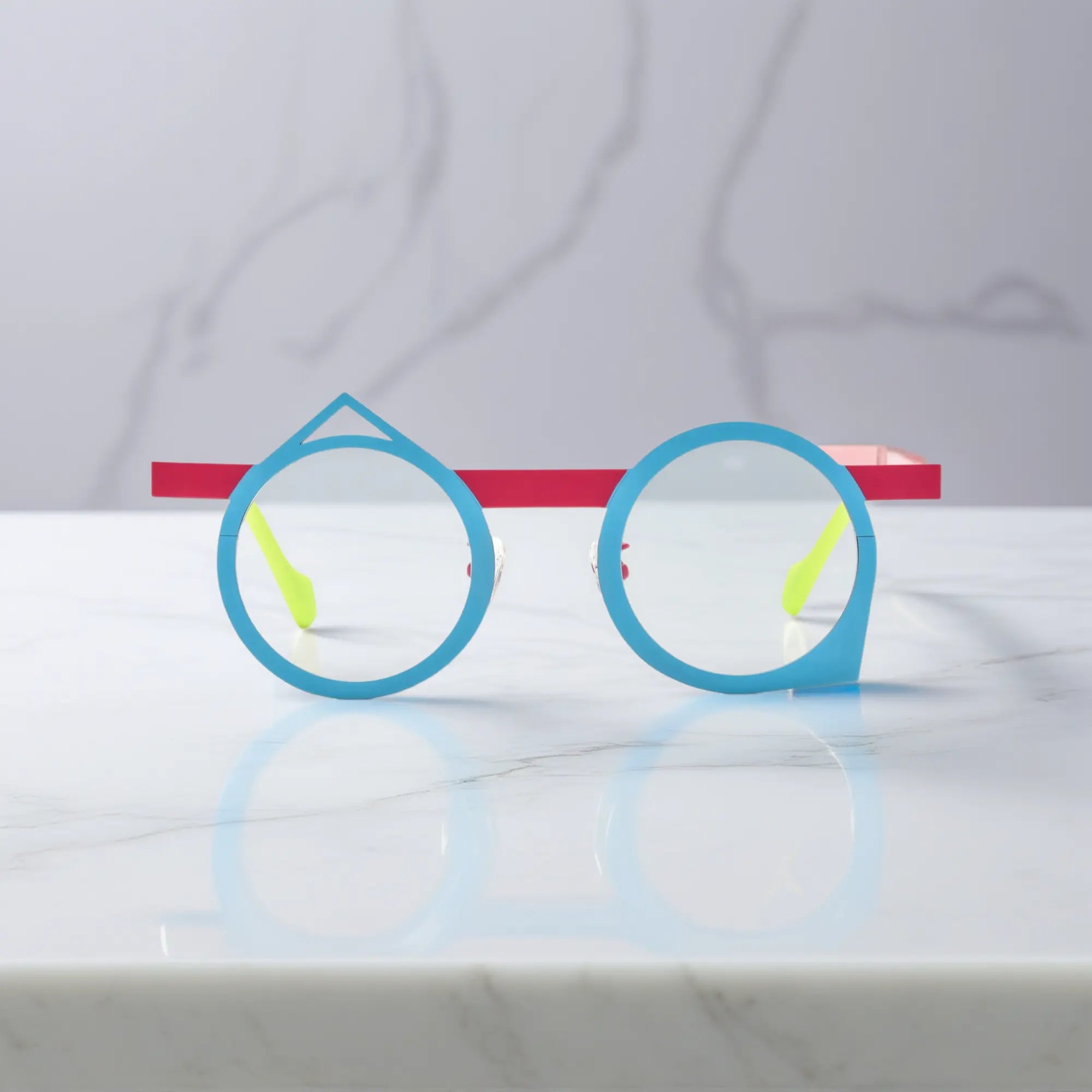 Front angle of VoyueLens™ VL185801 Berry Sky eyeglasses in titanium, with a striking blue-pink geometric frame.