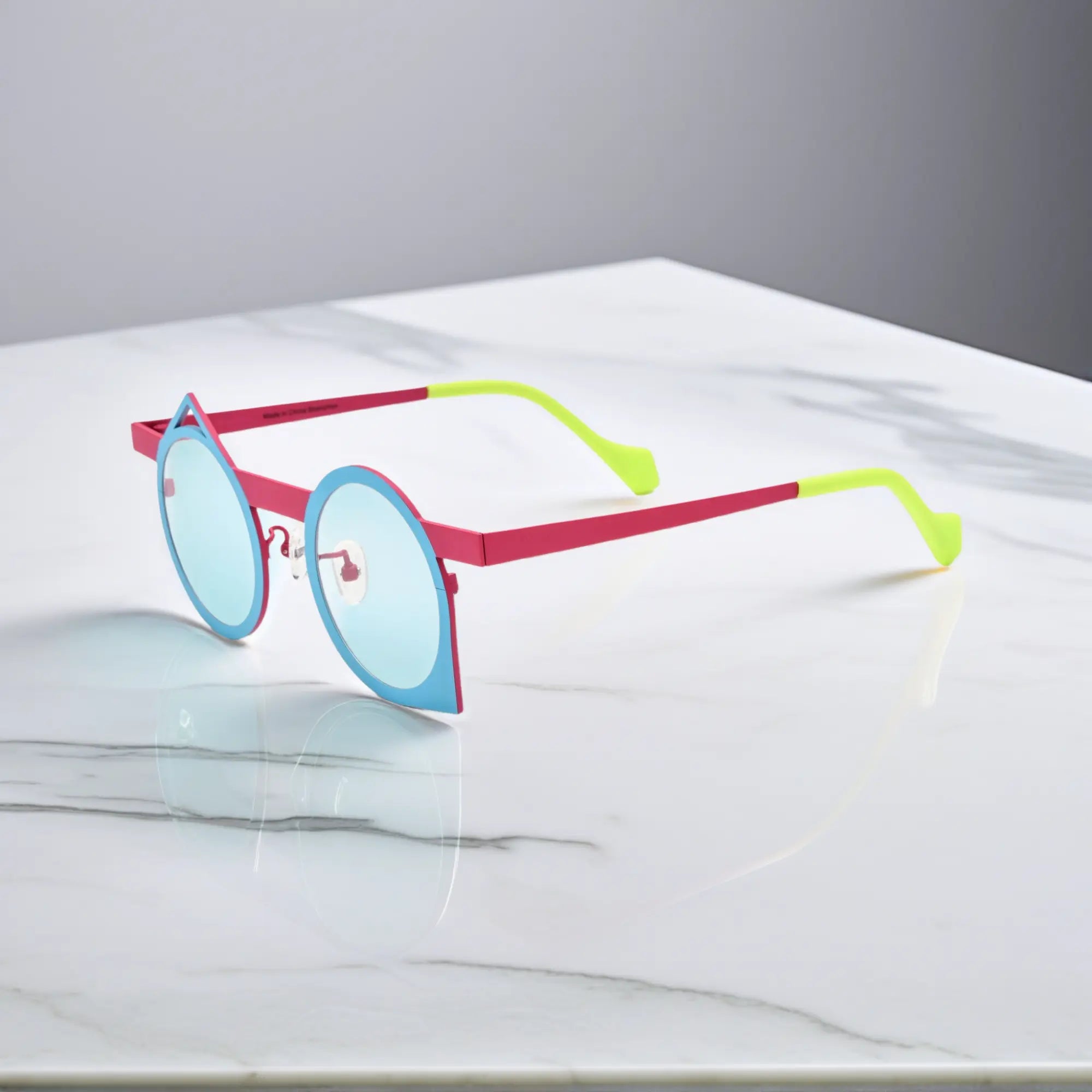 Side view of VoyueLens™ Berry Sky artistic titanium eyeglasses showing color-block design and retro curves.