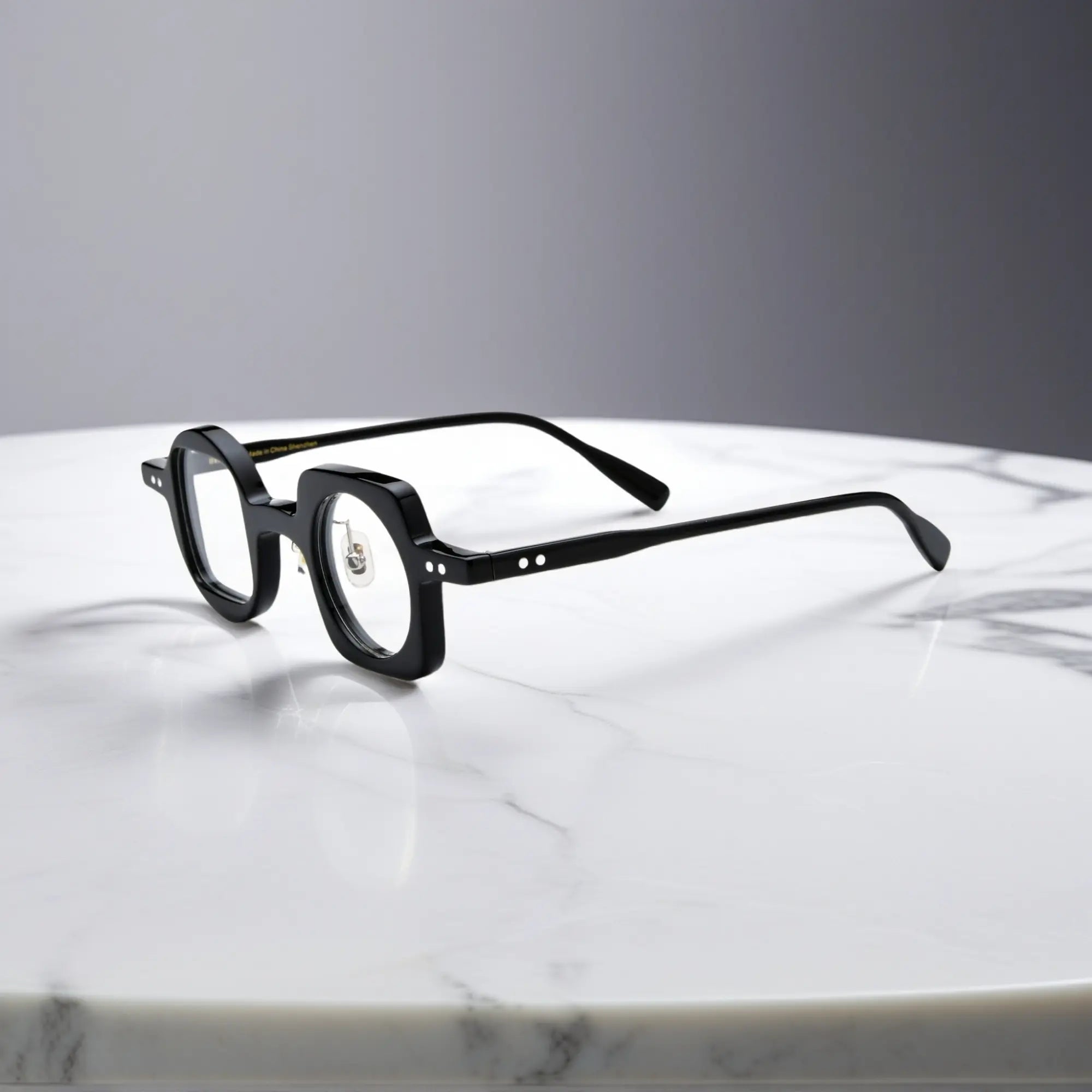 Side view showing the nano-polished black acetate frame of VoyueLens asymmetrical eyeglasses with ergonomic silicone nose pads.