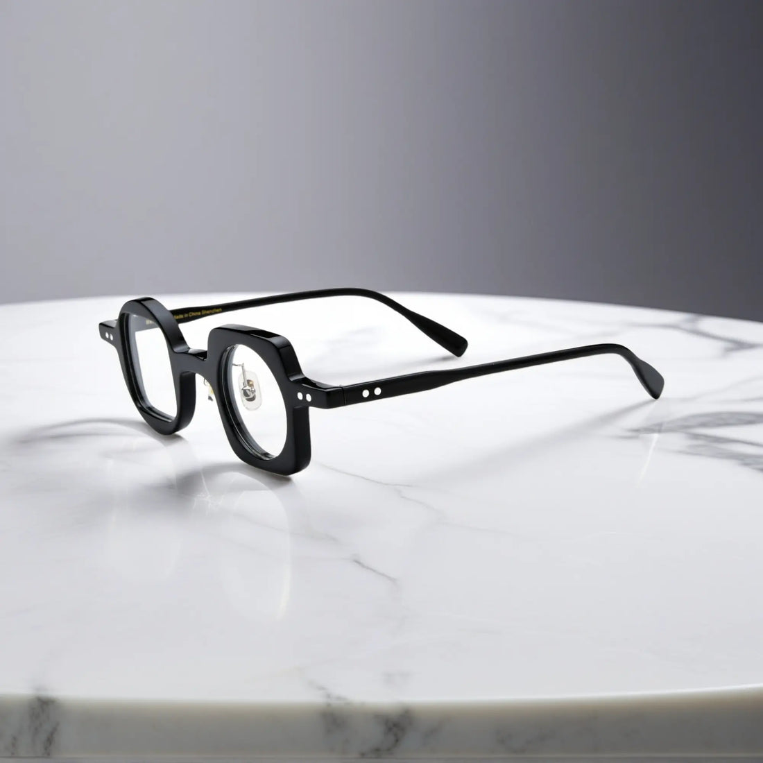 Side view showing the nano-polished black acetate frame of VoyueLens asymmetrical eyeglasses with ergonomic silicone nose pads.