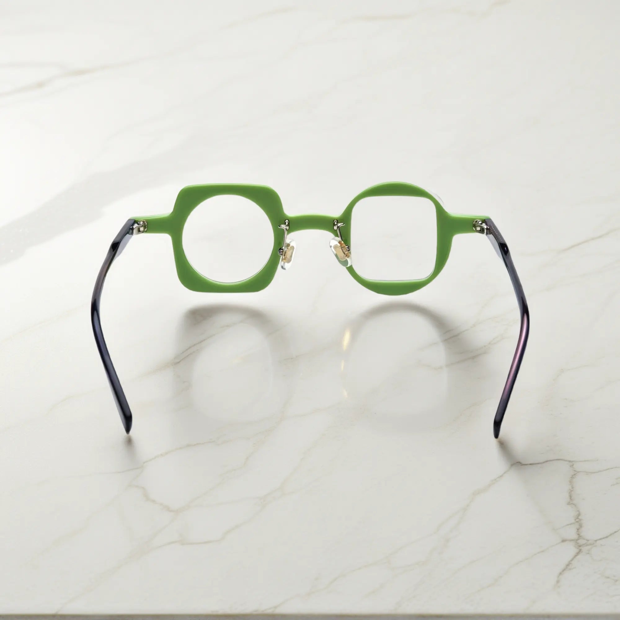 Back view of VoyueLens black-green asymmetrical eyeglasses highlighting silicone nose pads and strong standard hinges.purple temples