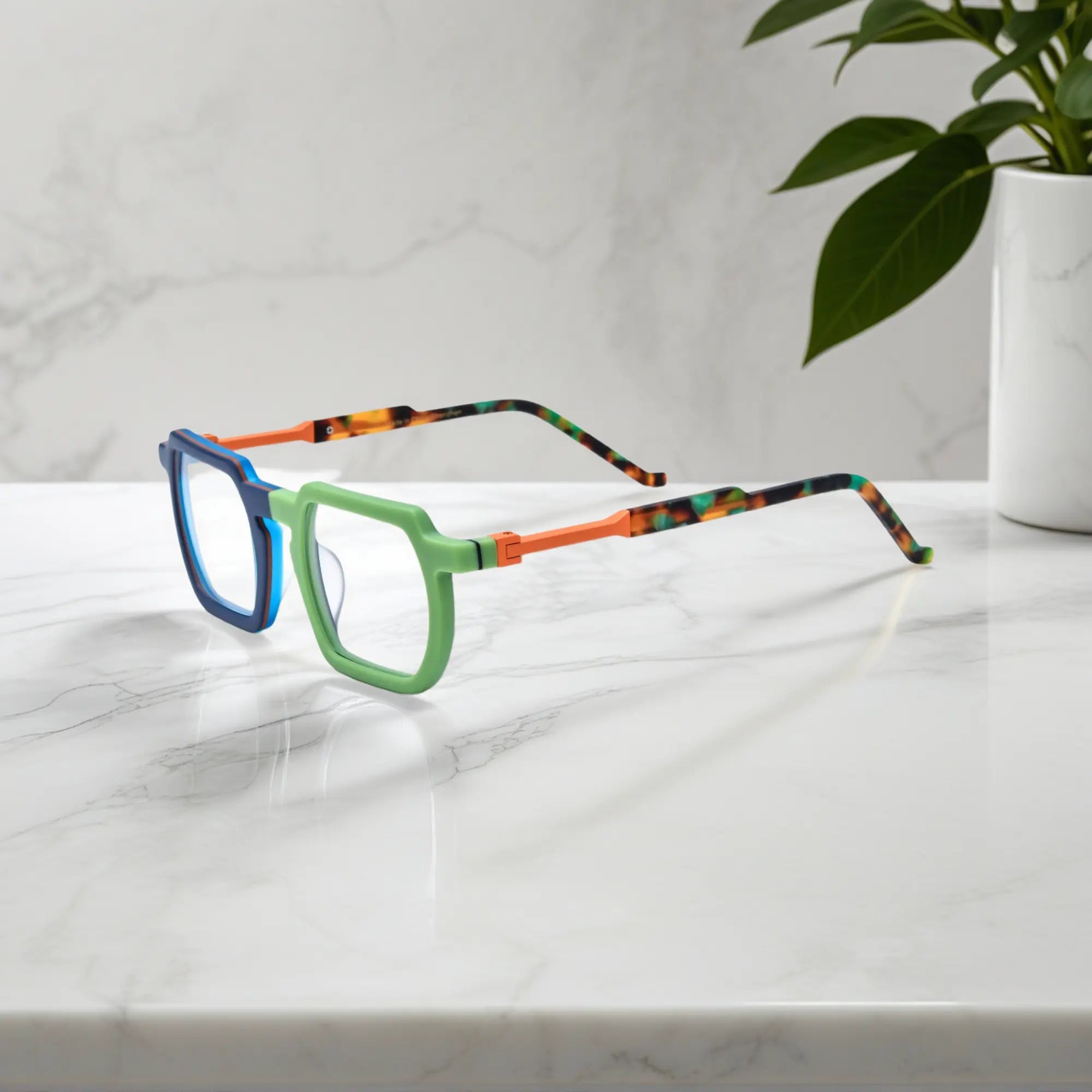 Side profile showing dual-tone blue-green acetate temples and artistic geometric design by VoyueLens™