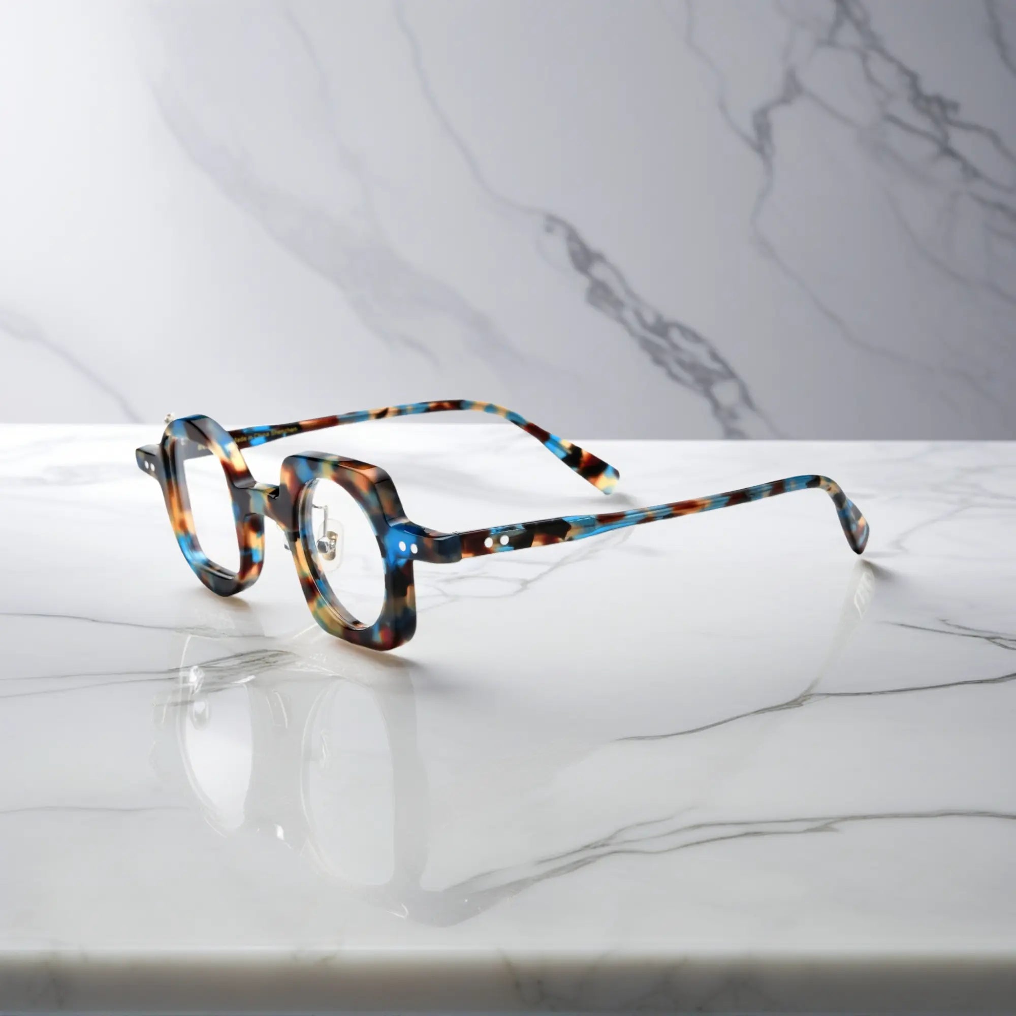 Side profile highlighting the blue tortoise colorway of VoyueLens asymmetrical glasses with comfortable silicone pads and sturdy hinges.