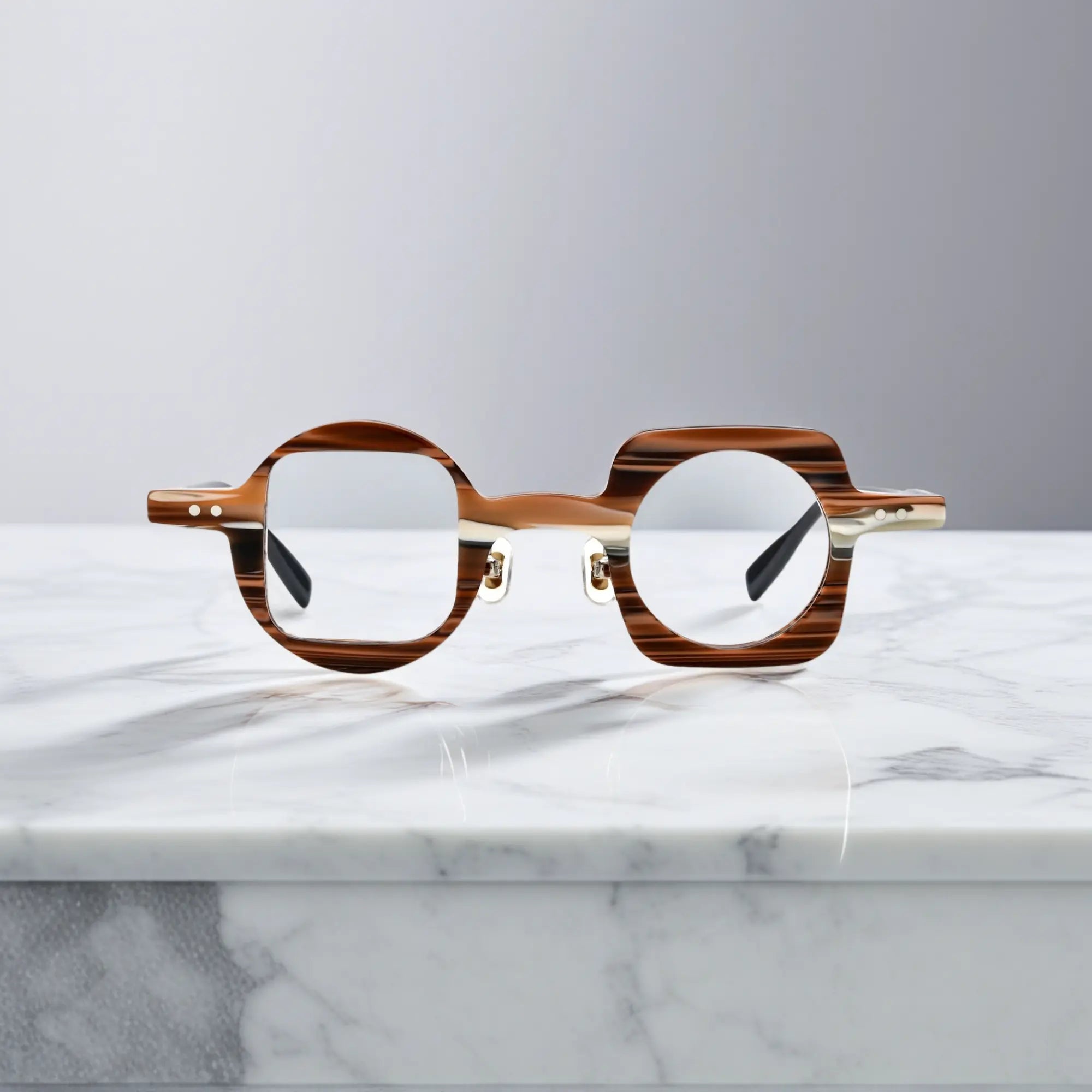 Front view of VoyueLens Designer Series asymmetrical eyeglasses in brown stripe acetate, lightweight and nano-polished for a stylish unisex fit.