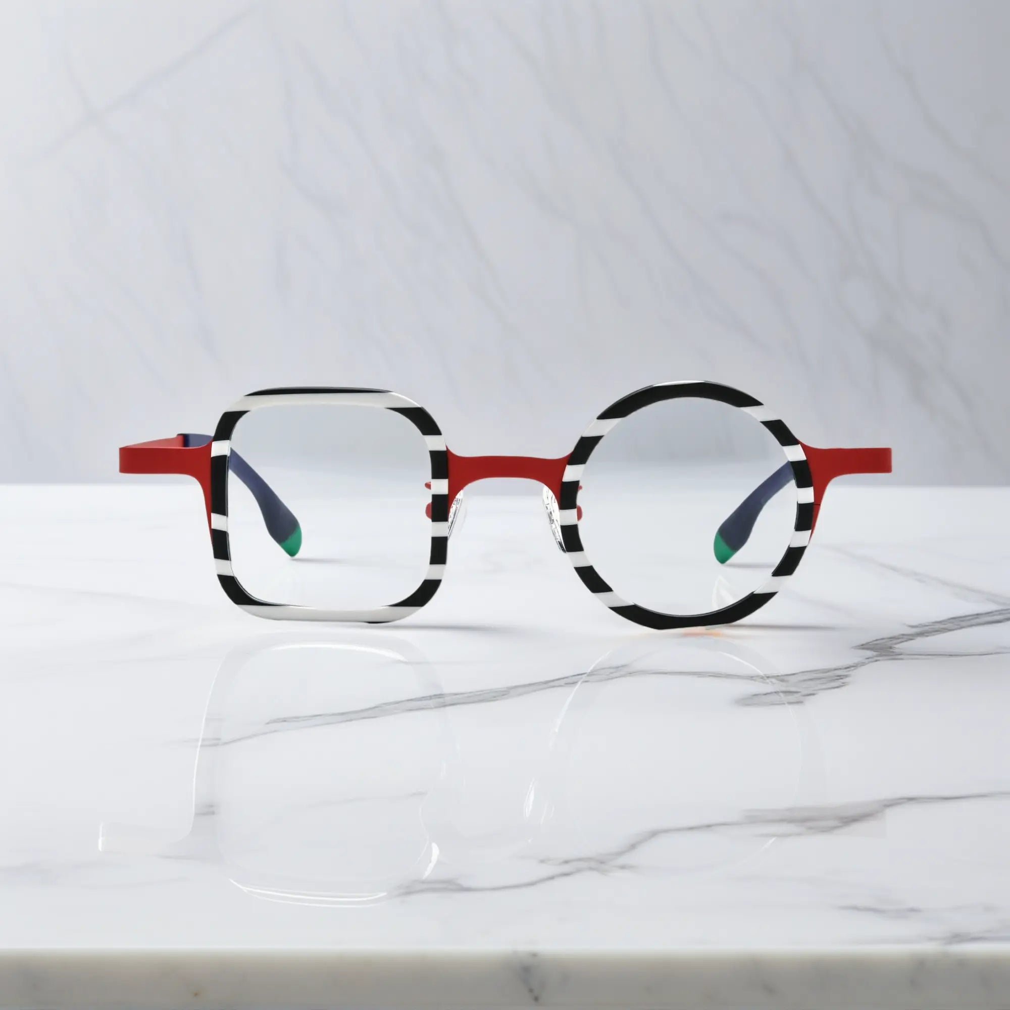 Front view of VoyueLens™ Candy Stripe Red eyeglasses with asymmetrical acetate front and titanium temples.