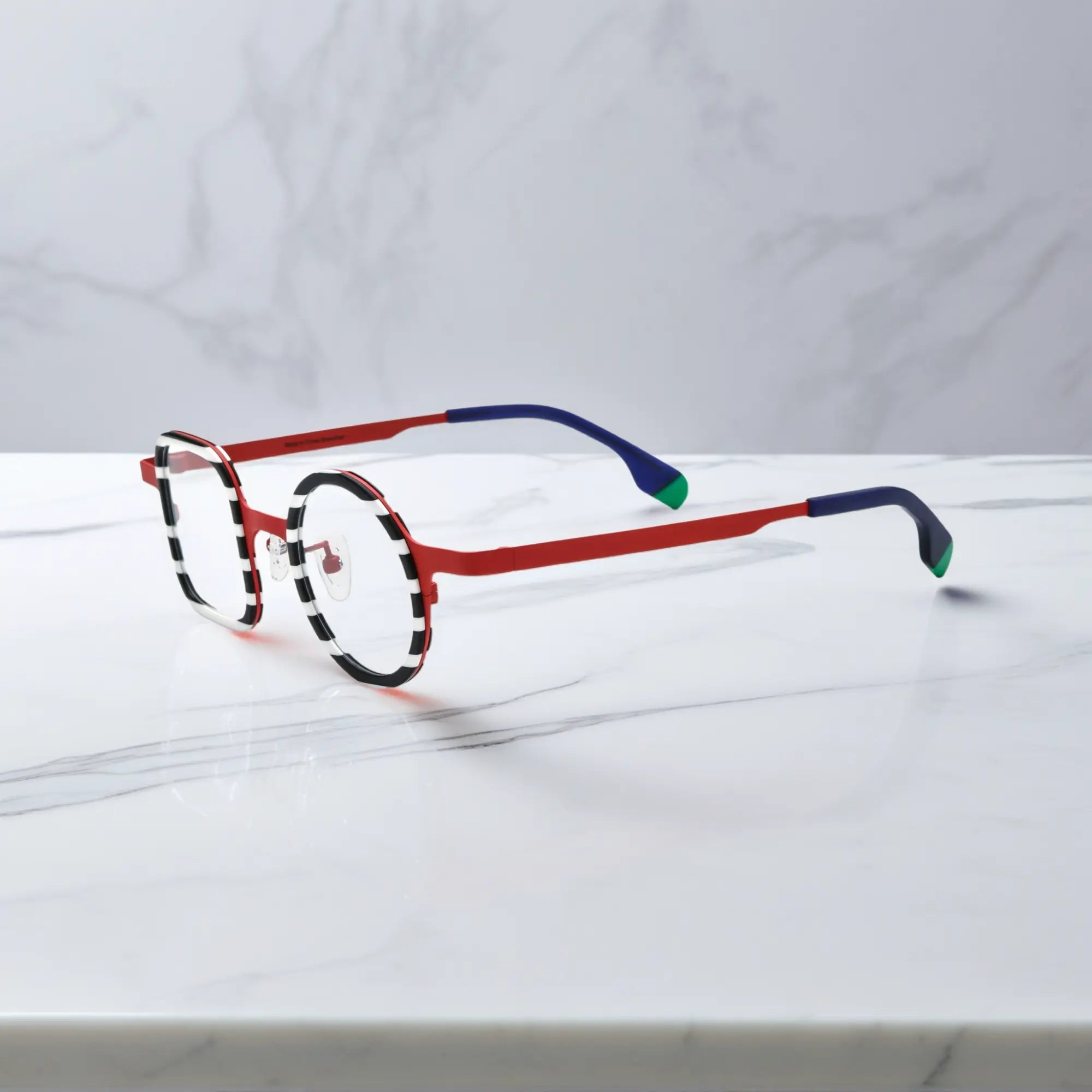 Side profile showing the titanium temple structure and gradient tips of Candy Stripe Red.