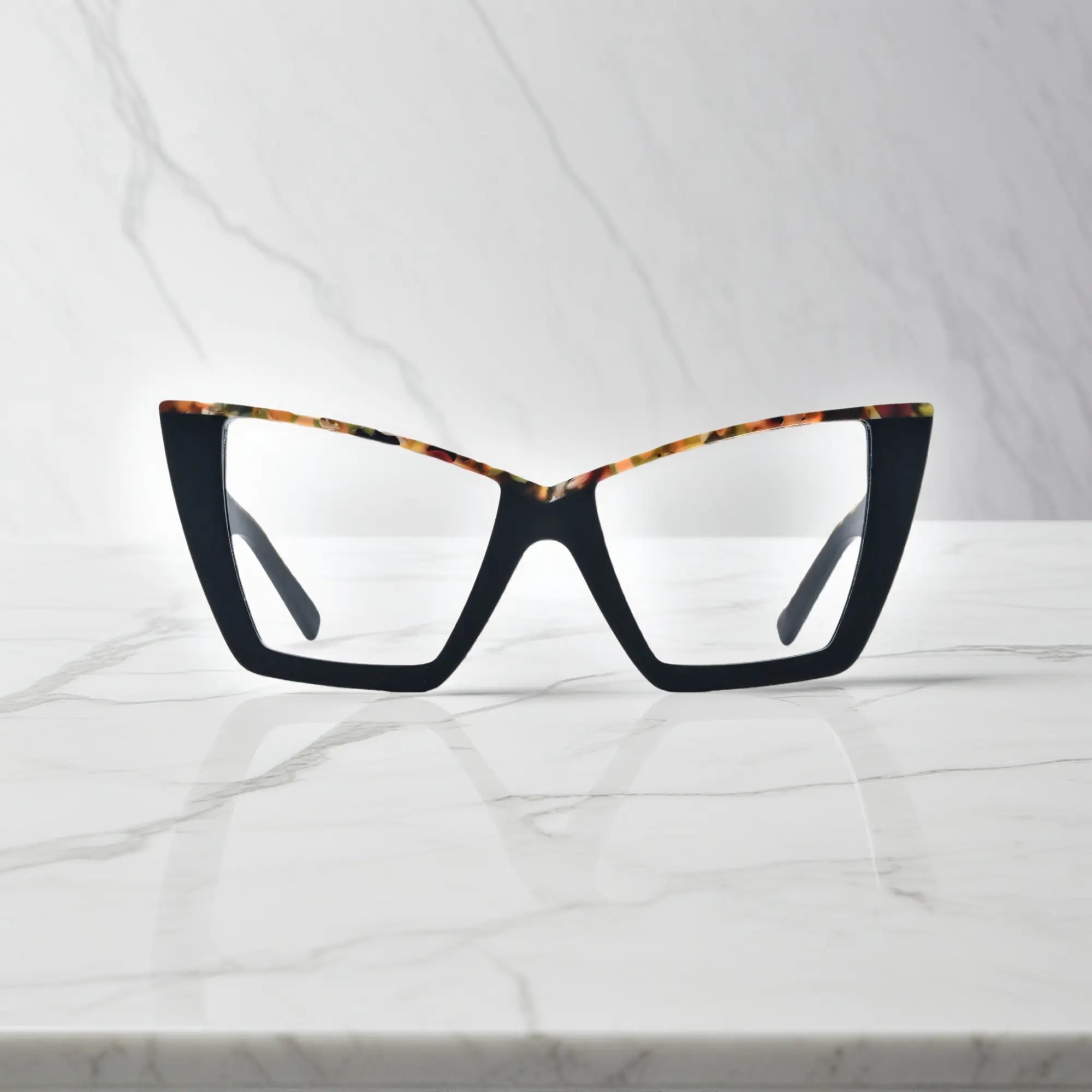 Front-facing image of VoyueLens™ oversized cat-eye glasses in Black-Blue Accent, featuring sharp silhouette with subtle blue inner trim for a modern contrast look