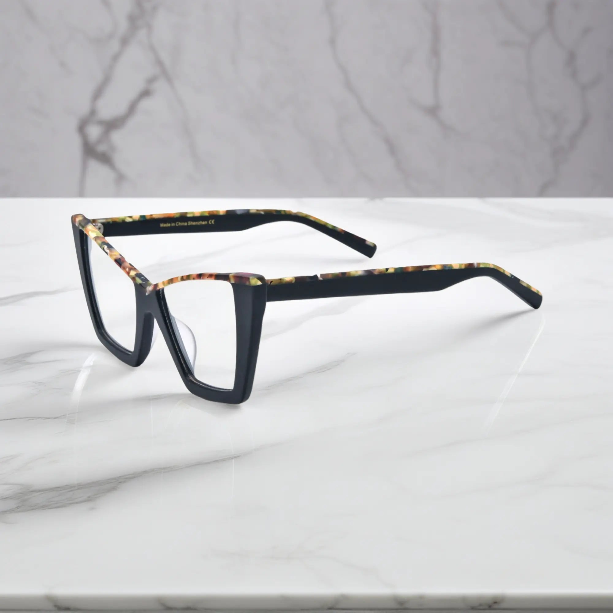 Side view of Black-Blue Accent VoyueLens™ acetate glasses showing lightweight temple design and glossy black exterior