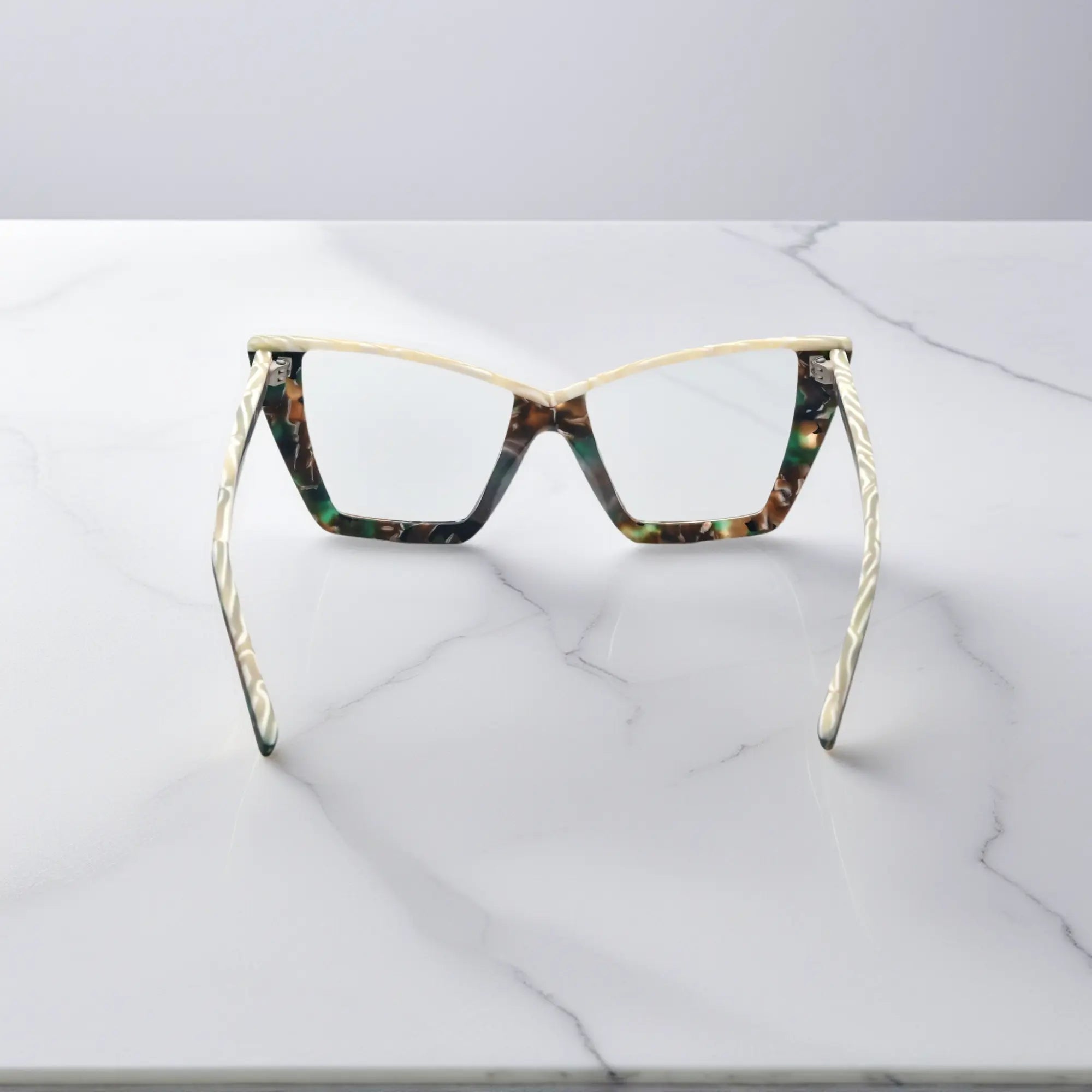 Rear angle of Olive Tortoise variant of VoyueLens™ cat-eye glasses, showing interior pattern and temple construction