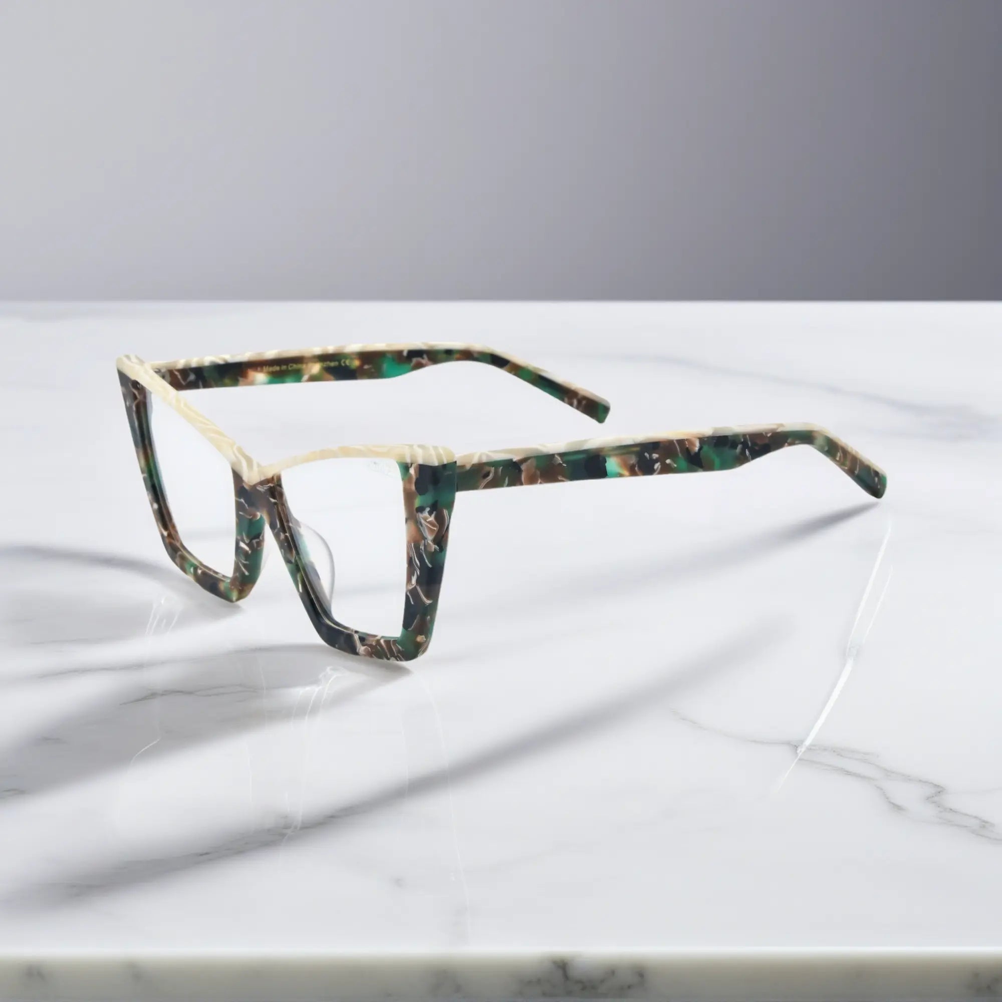 Side image of VoyueLens™ Olive Tortoise glasses showing full acetate temples and refined curves of the oversized butterfly frame