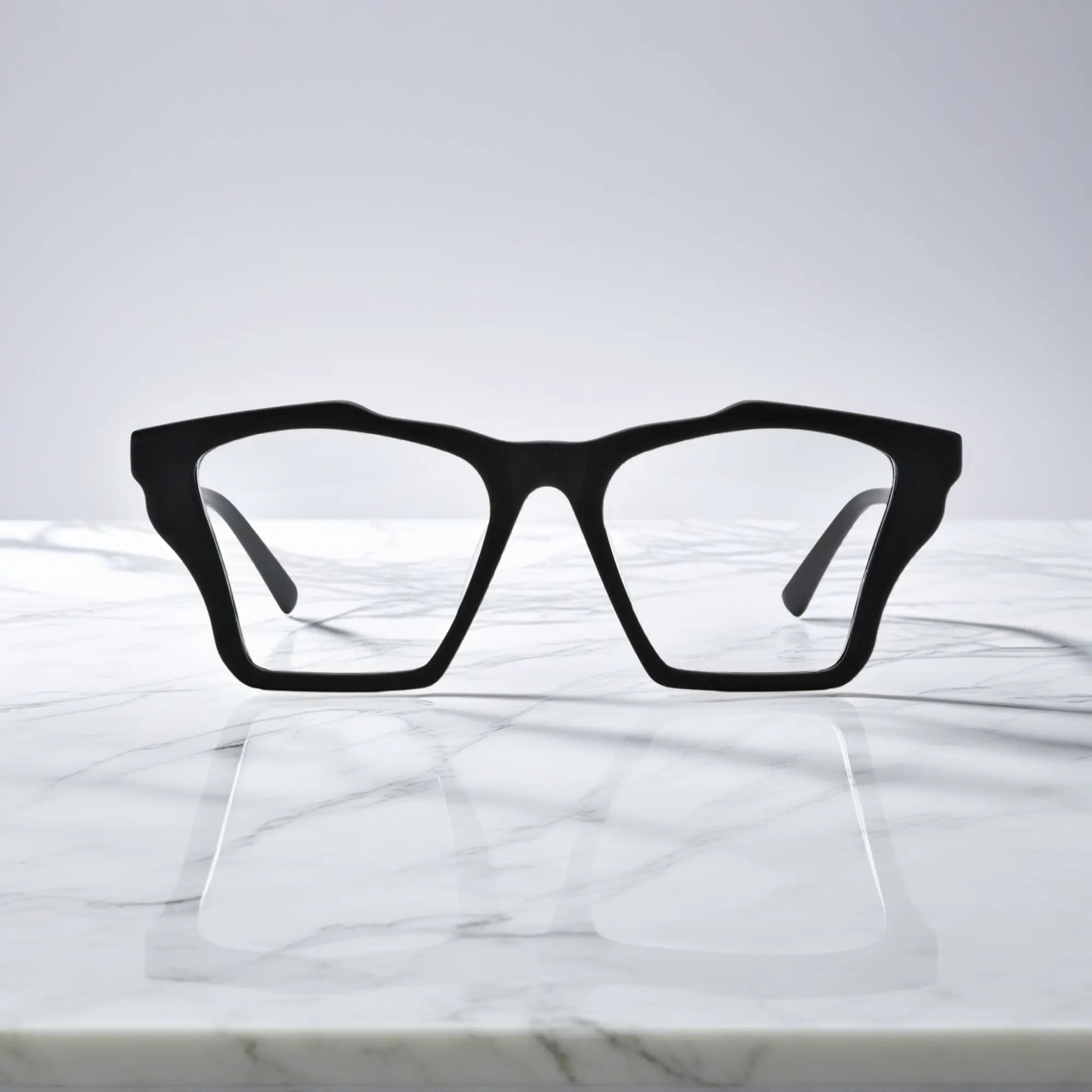 Front-facing view of VoyueLens™ Charcoal Black butterfly eyeglass frame featuring solid matte black with subtle gray temples, showcasing its signature matte butterfly design.