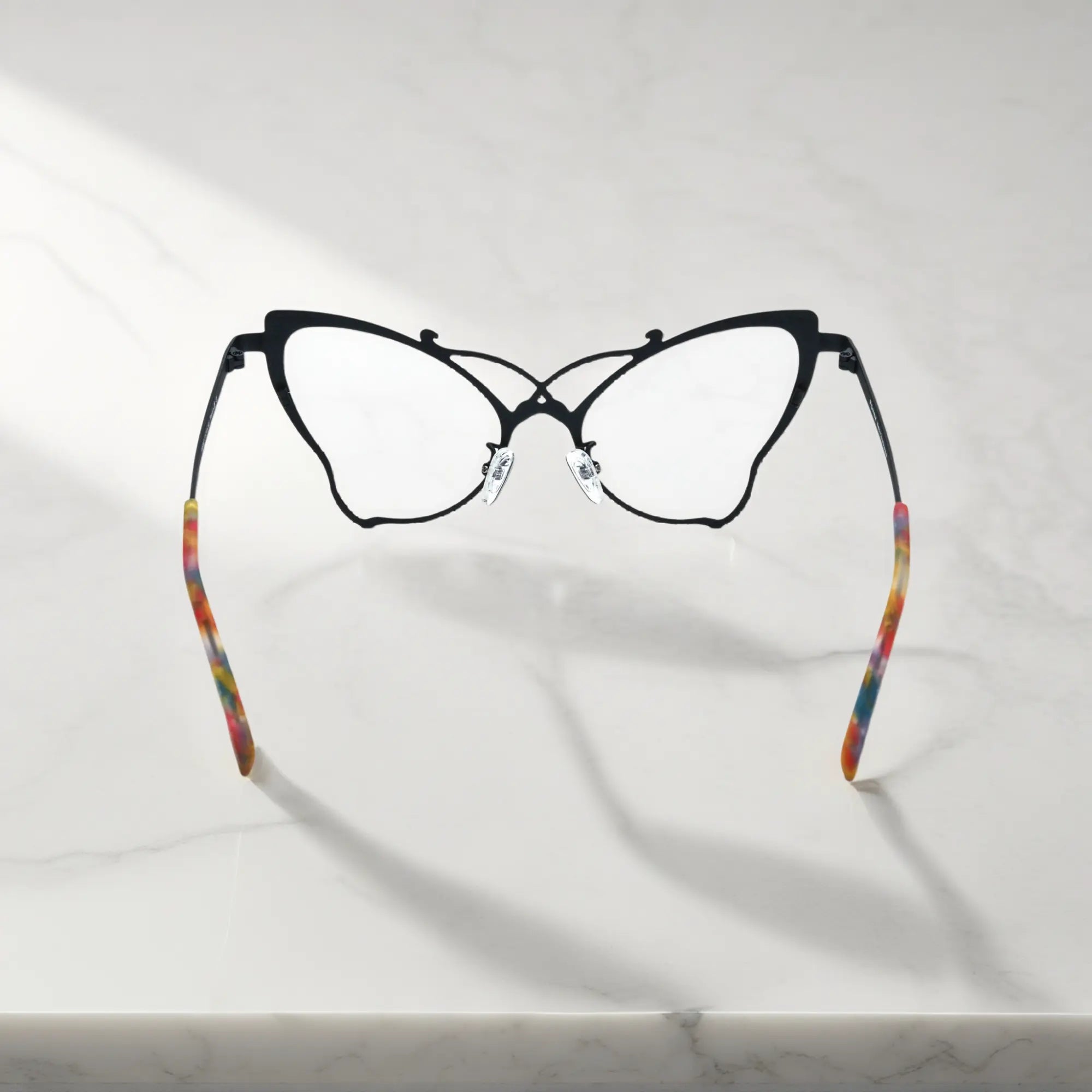 Back of VoyueLens™ VL185862 titanium butterfly eyeglasses in Charcoal Black – a lightweight, colorful, vintage-inspired, prescription ready frame designed for unique artistic style and everyday comfort.