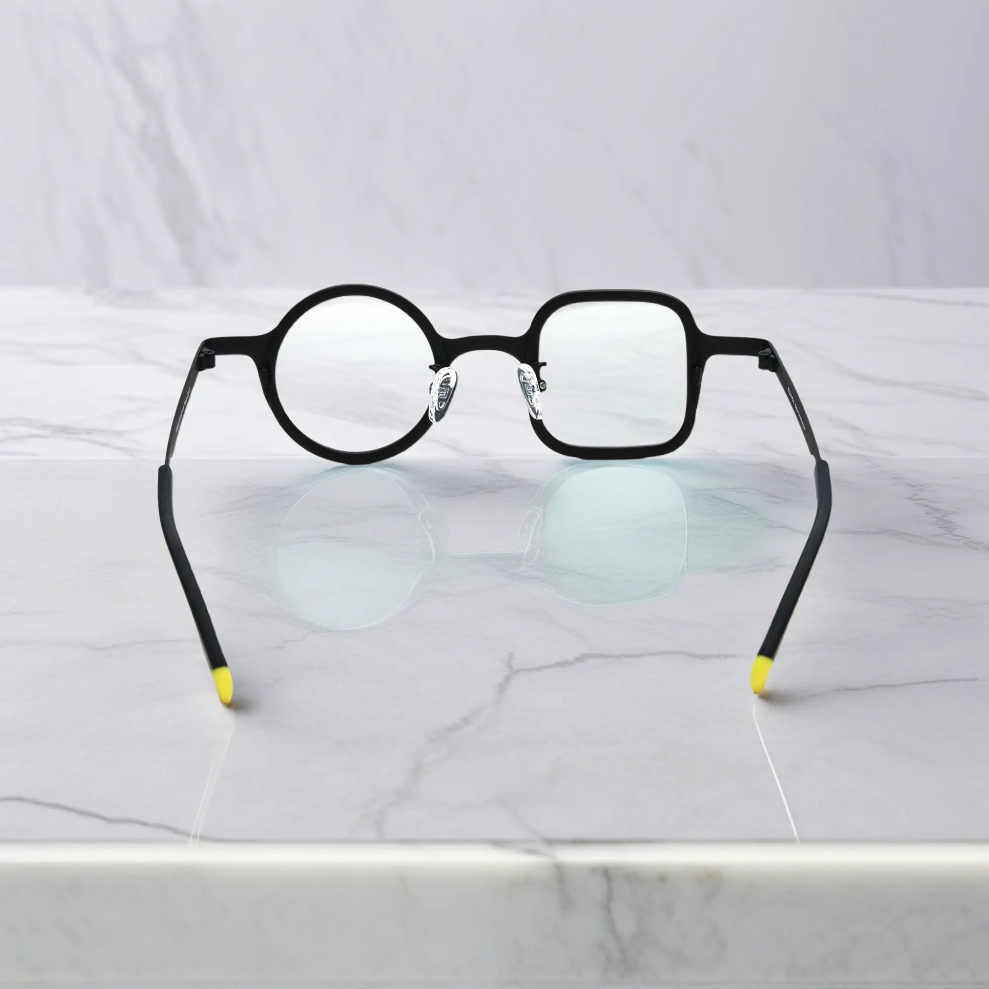 Rear view of all-black frame showing symmetry and ergonomic construction.