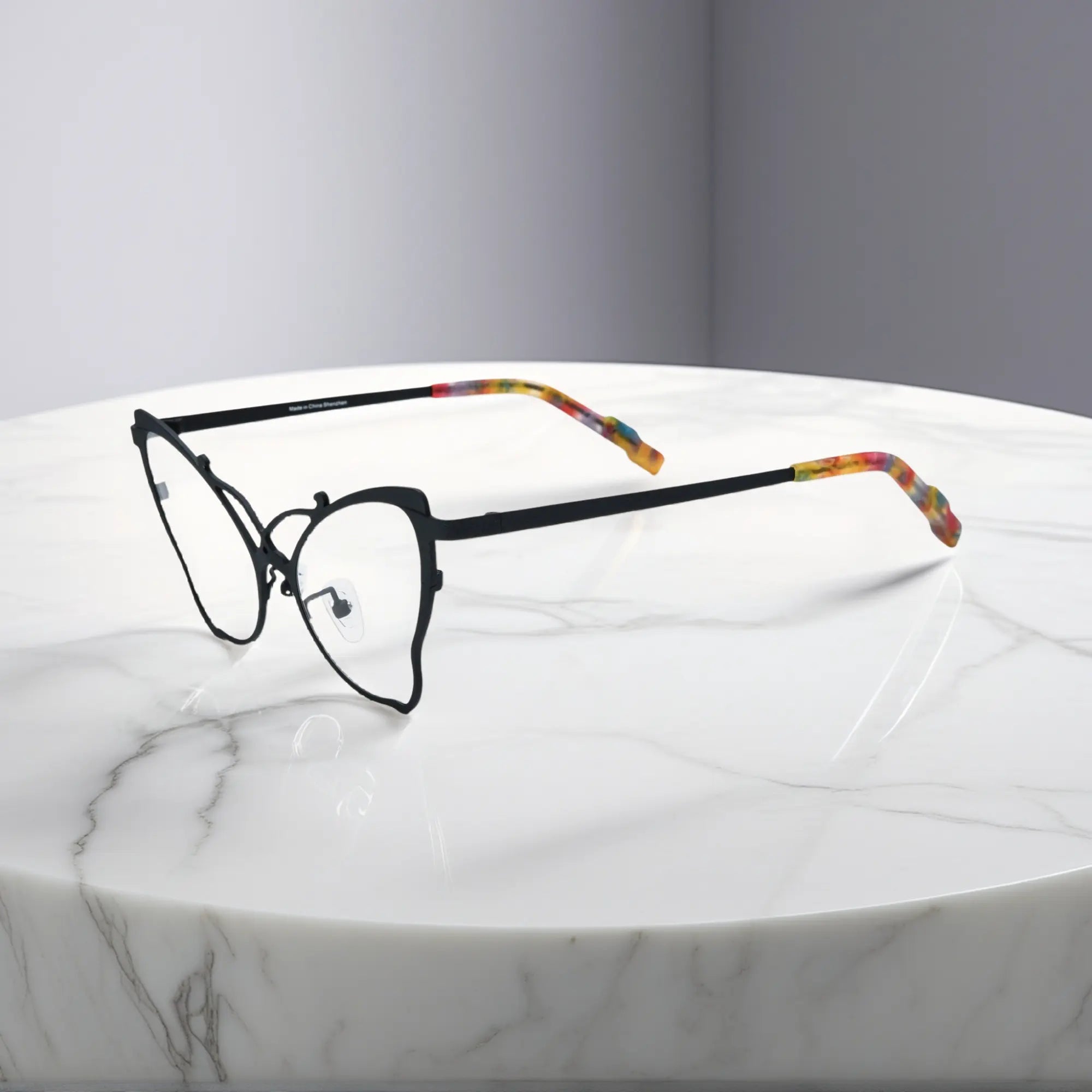 Side of VoyueLens™ VL185862 titanium butterfly eyeglasses in Charcoal Black – a lightweight, colorful, vintage-inspired, prescription ready frame designed for unique artistic style and everyday comfort.