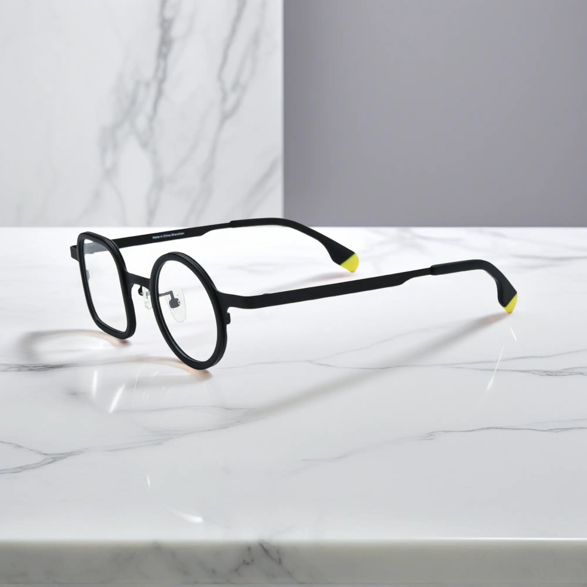 Sleek side profile of Charcoal Black VoyueLens™ frame with ultra-light titanium build.