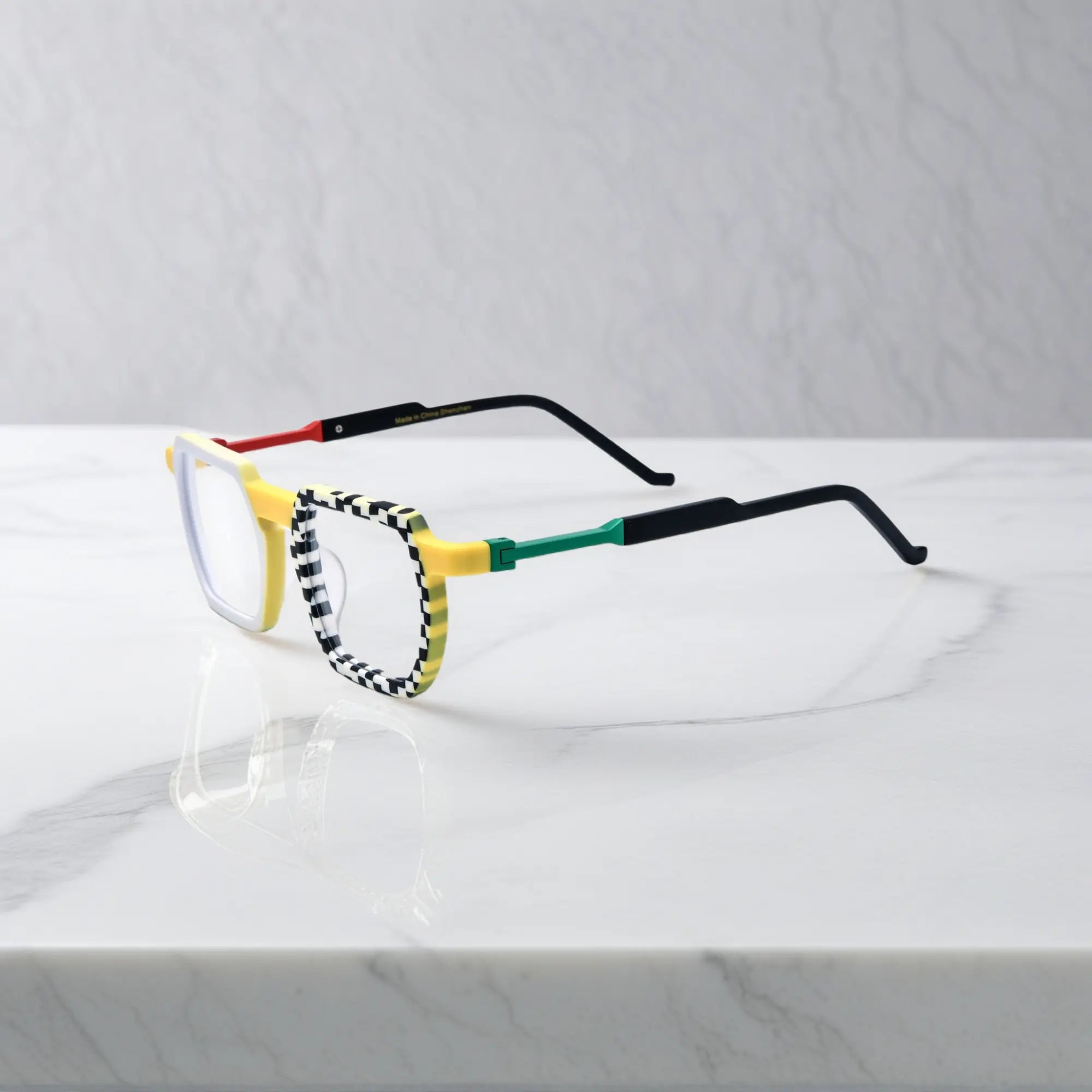 Side view highlighting yellow-black checker pattern on acetate arms with edgy streetwear flair