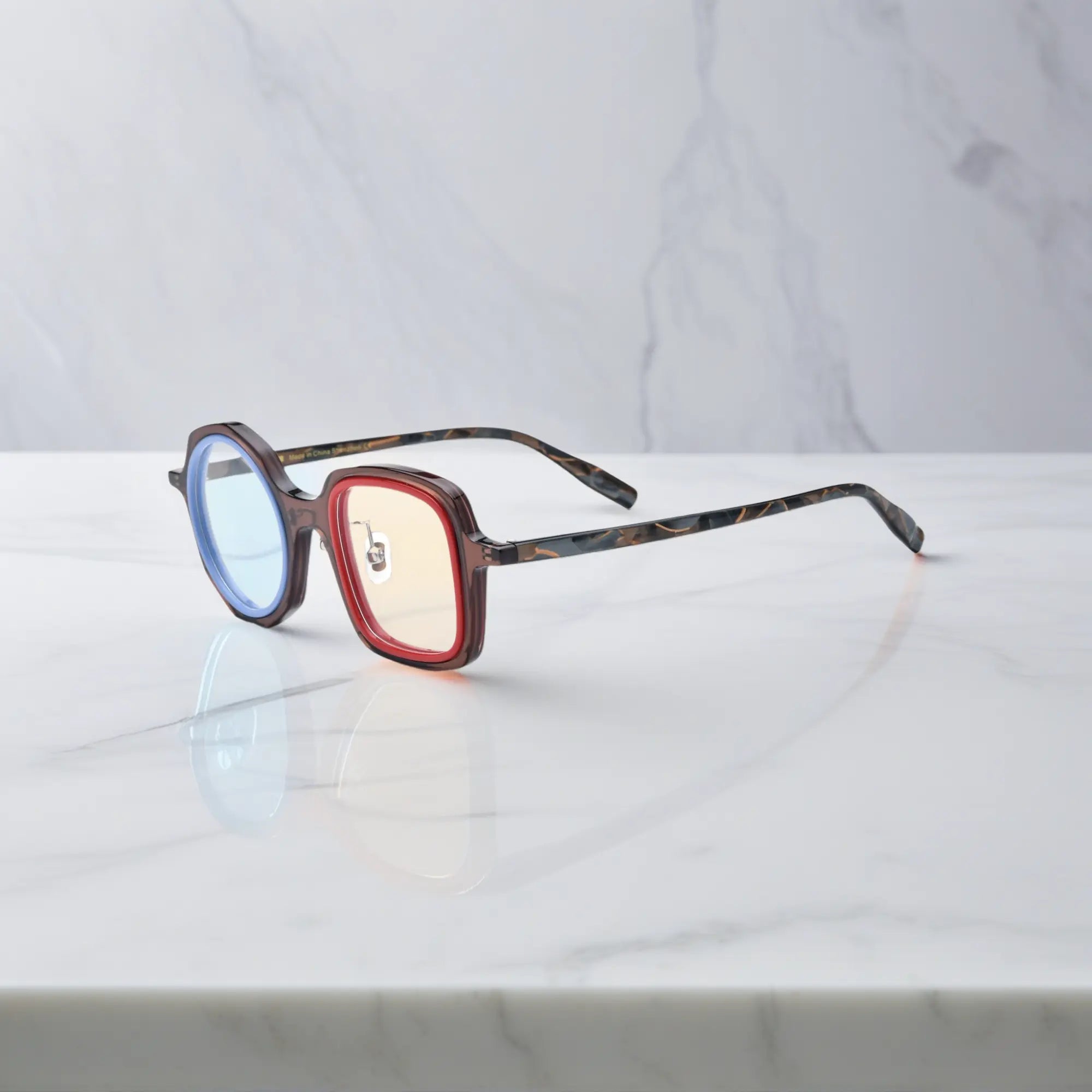 VoyueLens™ geometric eyeglasses in Chestnut Blue color, side view showing dual-tone design and spring hinges.