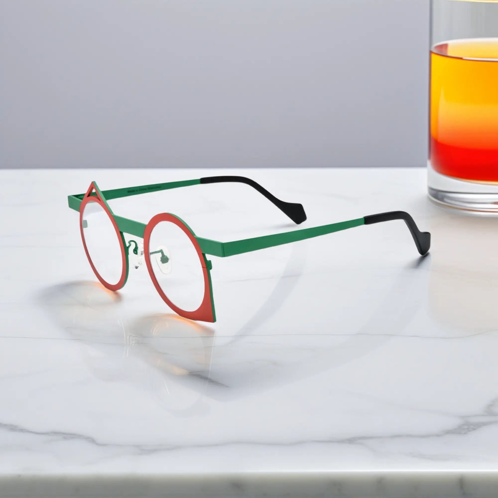 Side profile of VoyueLens™ Chili Emerald VL185801 eyeglasses showcasing the ultra-light pure titanium structure and artistic silhouette.