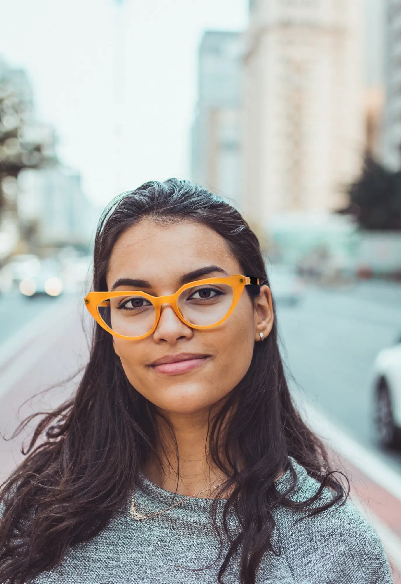Street-style model photo wearing Citrus Amber VoyueLens™ butterfly eyeglasses, perfect for bold fashion lovers.