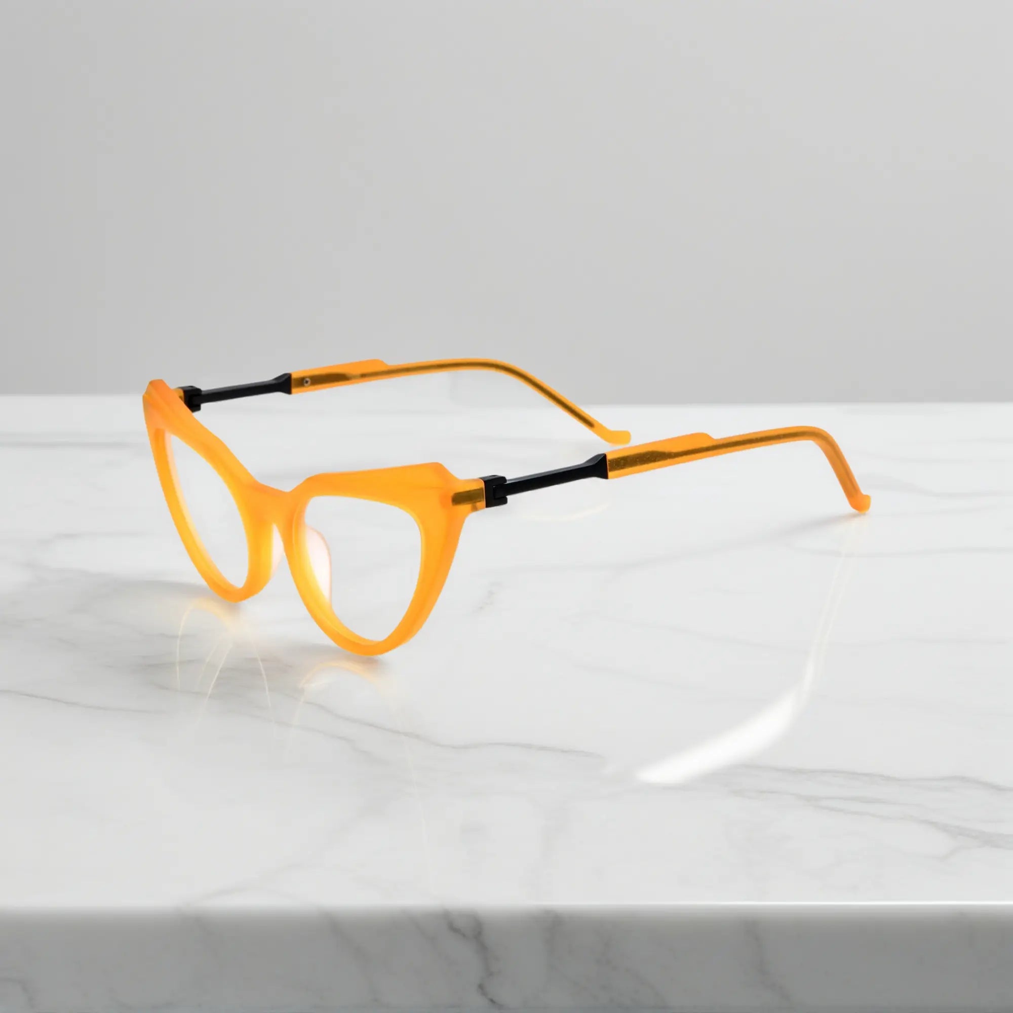 Side profile of Citrus Amber VoyueLens™ butterfly eyeglasses with tapered matte temples and comfortable spring hinges.