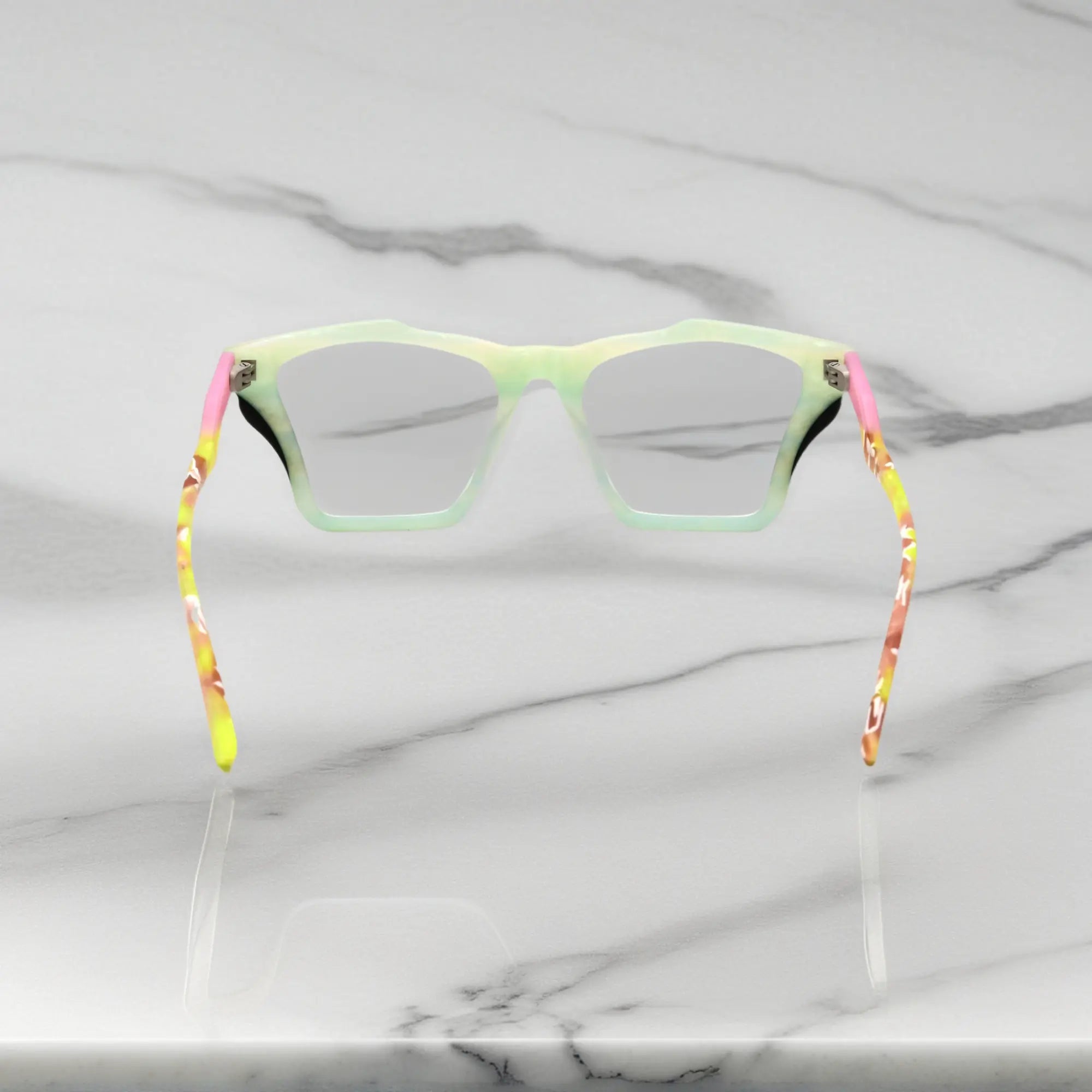Rear view of VoyueLens™ Citrus Fade frame, displaying lime green front with pink-accented temples from the inner frame and hinge area.