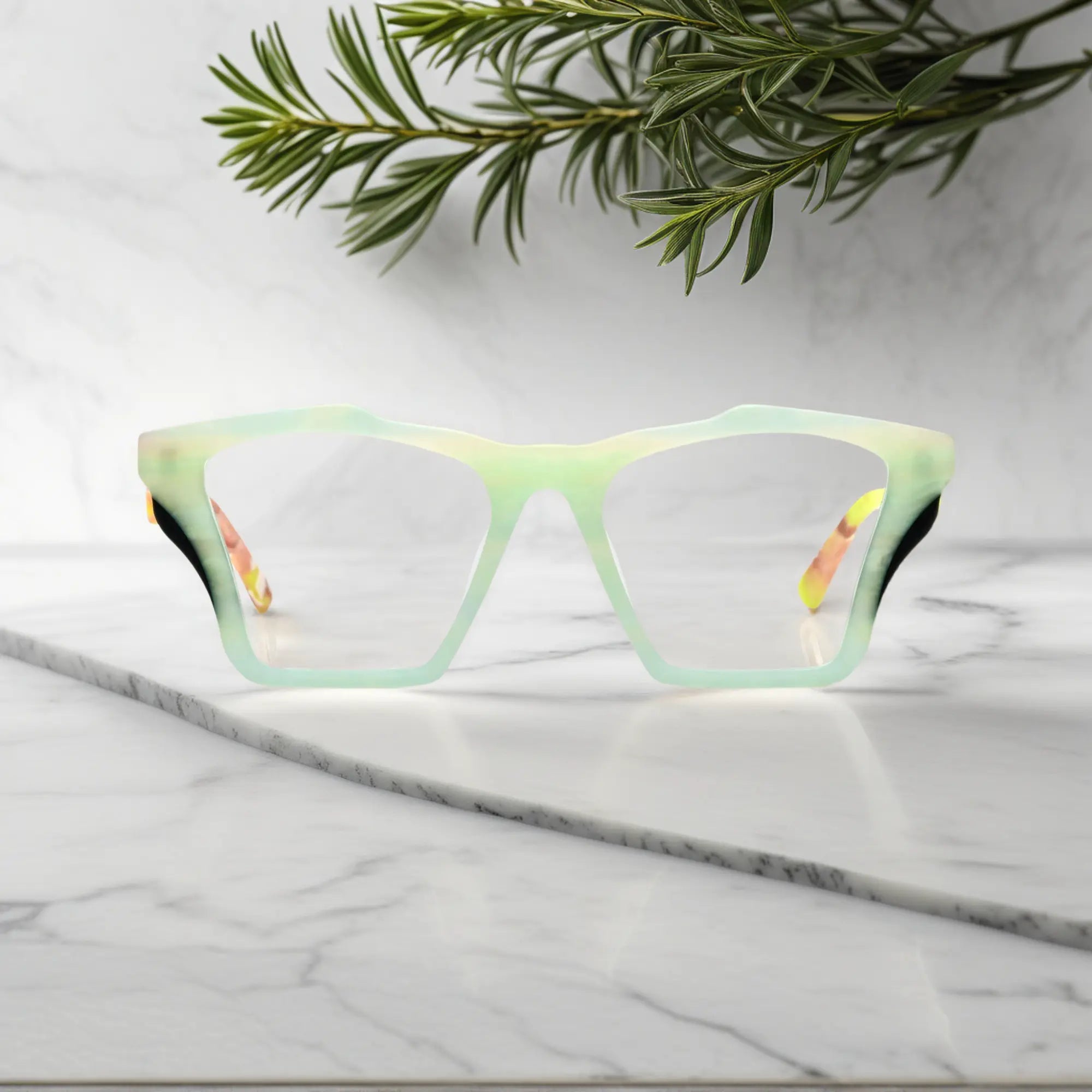 Front-facing view of VoyueLens™ Citrus Fade butterfly eyeglass frame featuring lime green front with pink-accented temples, showcasing its signature matte butterfly design.