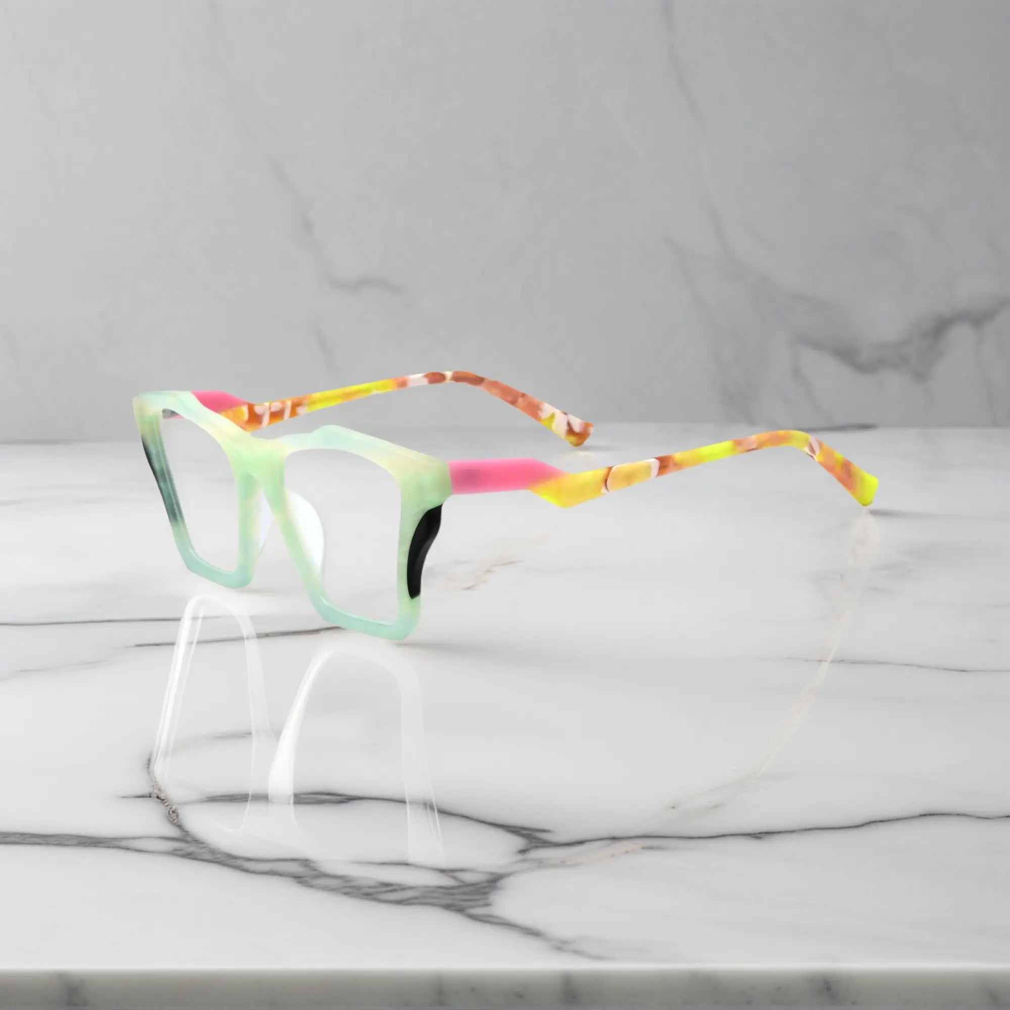 Side profile of VoyueLens™ Citrus Fade glasses, highlighting lime green front with pink-accented temples and ergonomic acetate arms.