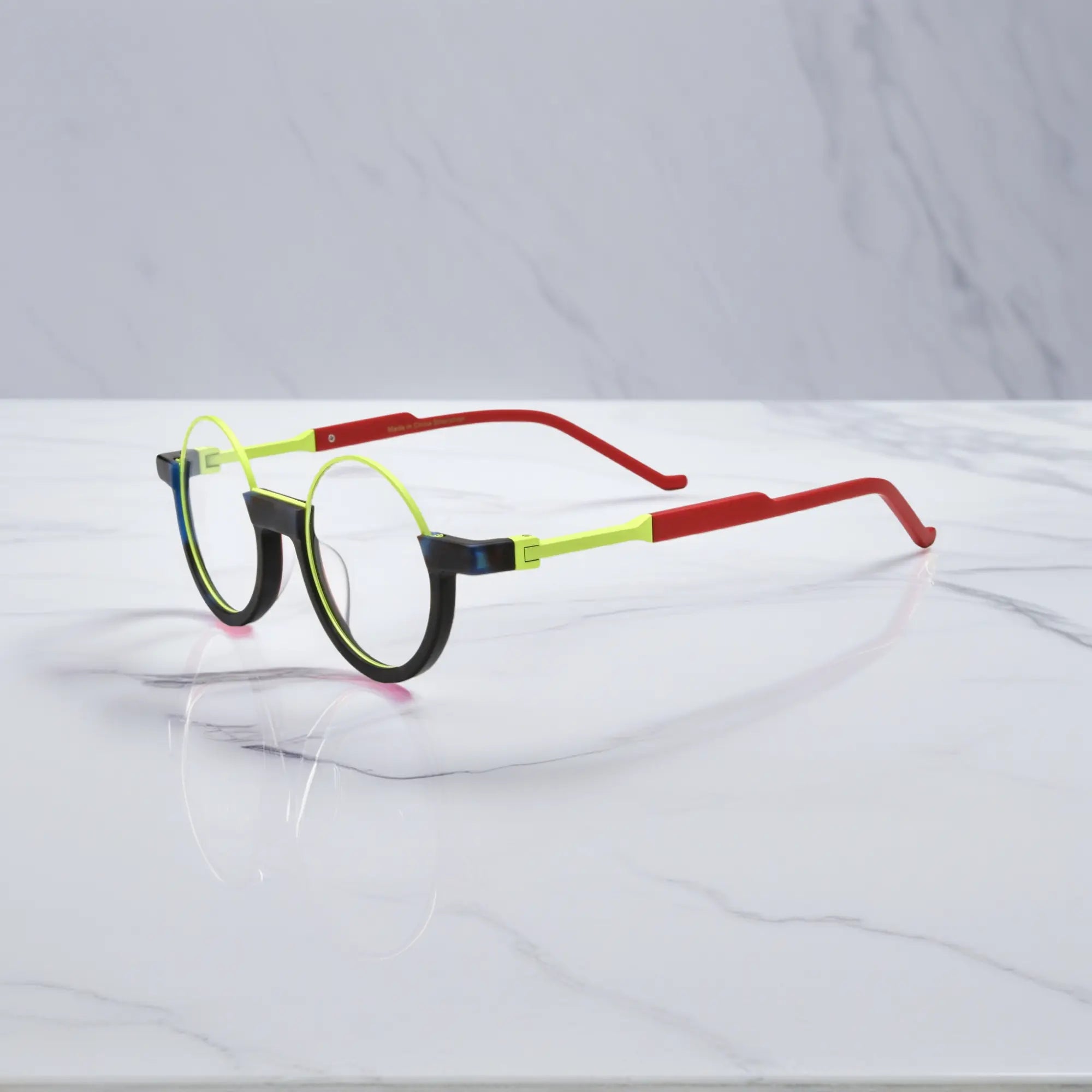 Side angle of Citrus Fade showing its zesty lime hues and fluid round contours in acetate form.