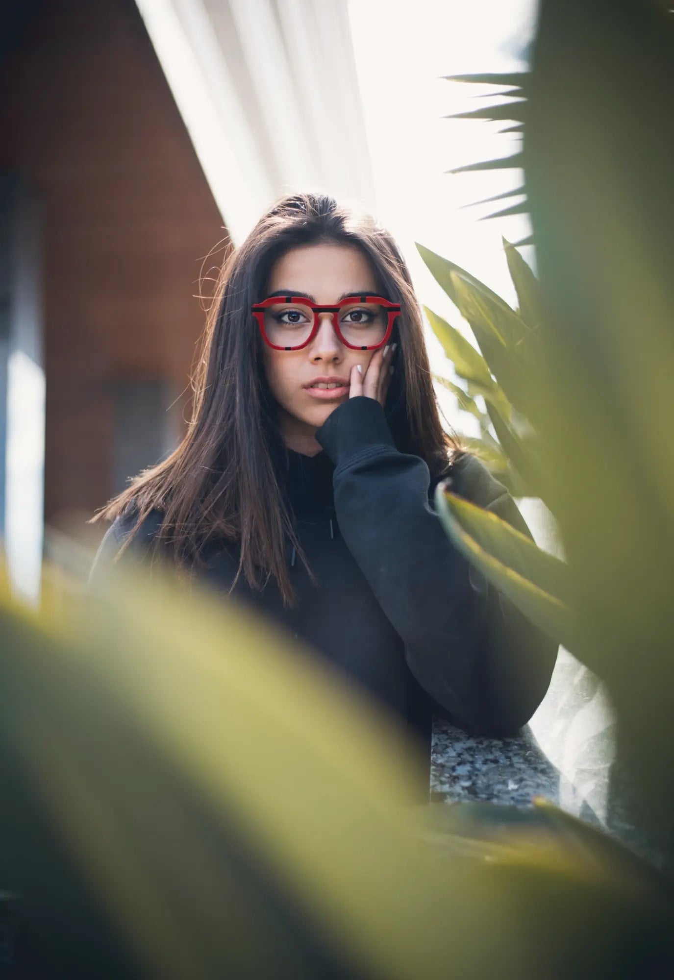 Urban portrait of model in VoyueLens™ Crimson Impact eyeglasses