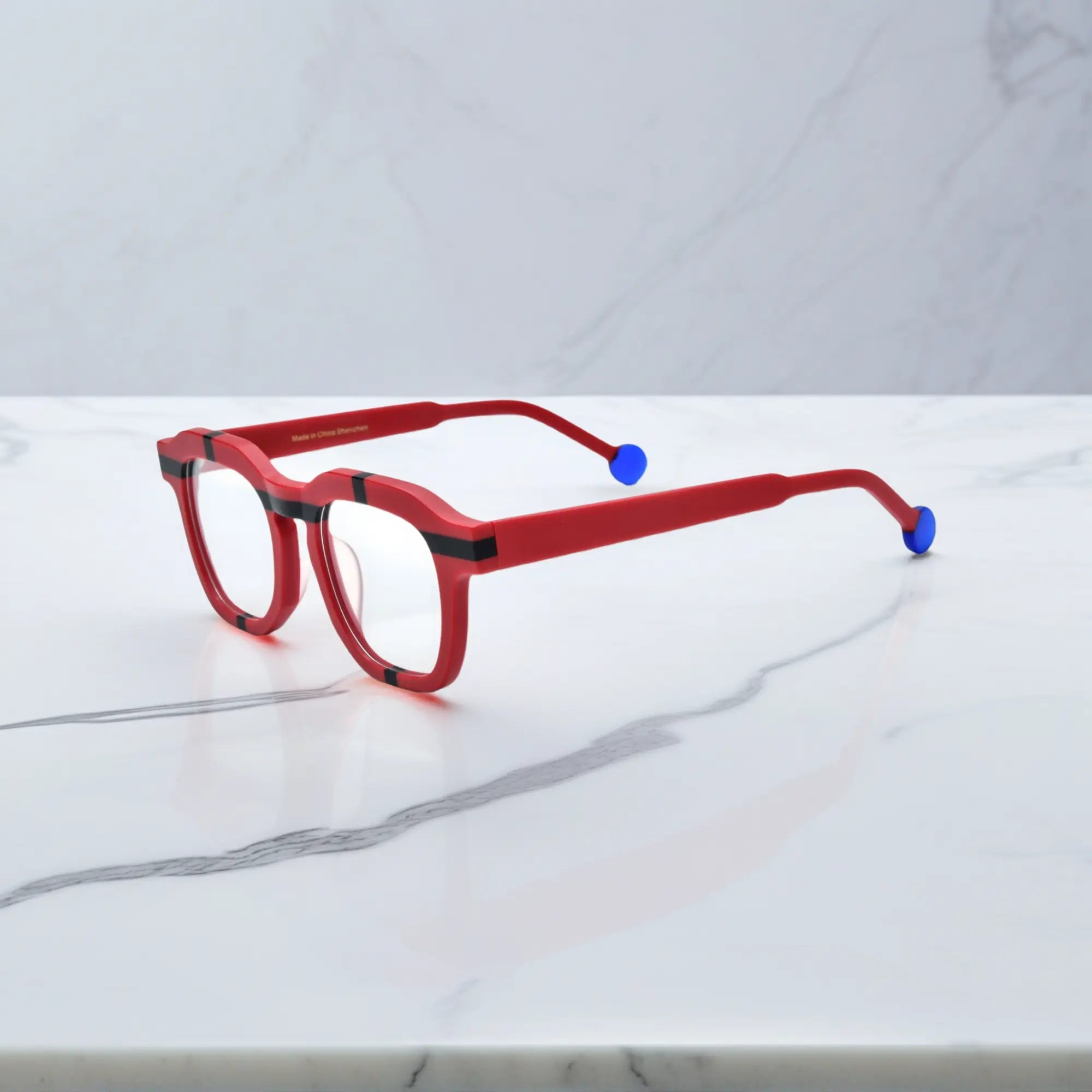 Side view of VoyueLens™ VL19363 Crimson Impact red eyeglasses with blue tips