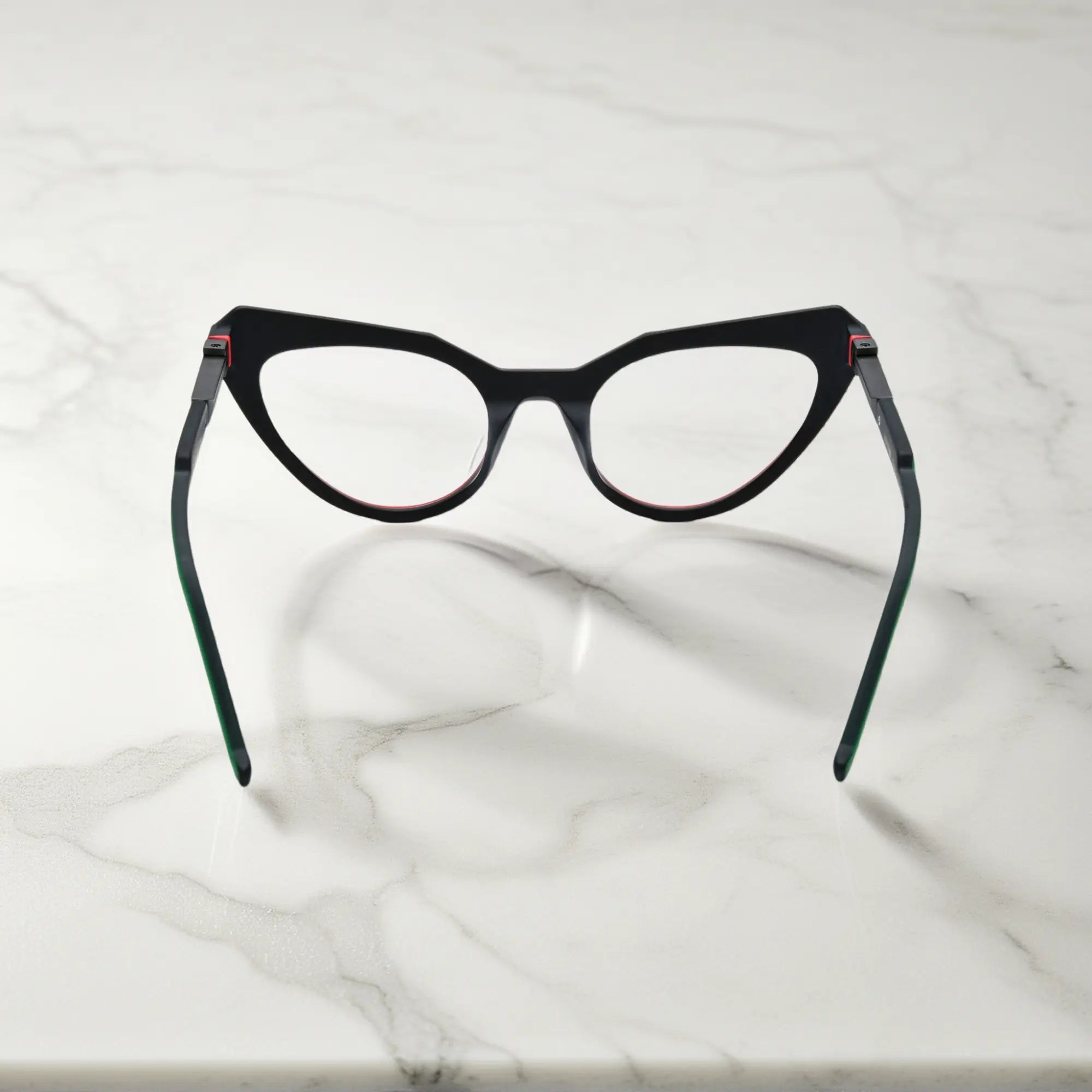 Rear display of Crimson Nebula matte acetate frame with sculpted design and high contrast colors.
