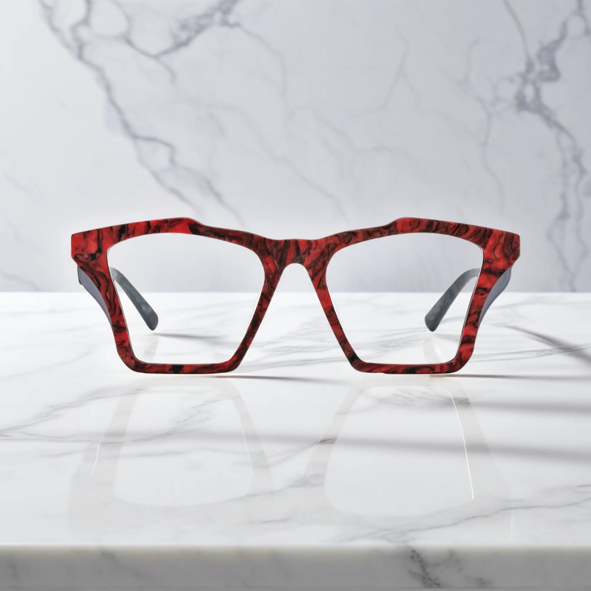 Front-facing view of VoyueLens™ Crimson Nebula butterfly eyeglass frame featuring matte crimson red with cosmic black accents, showcasing its signature matte butterfly design.