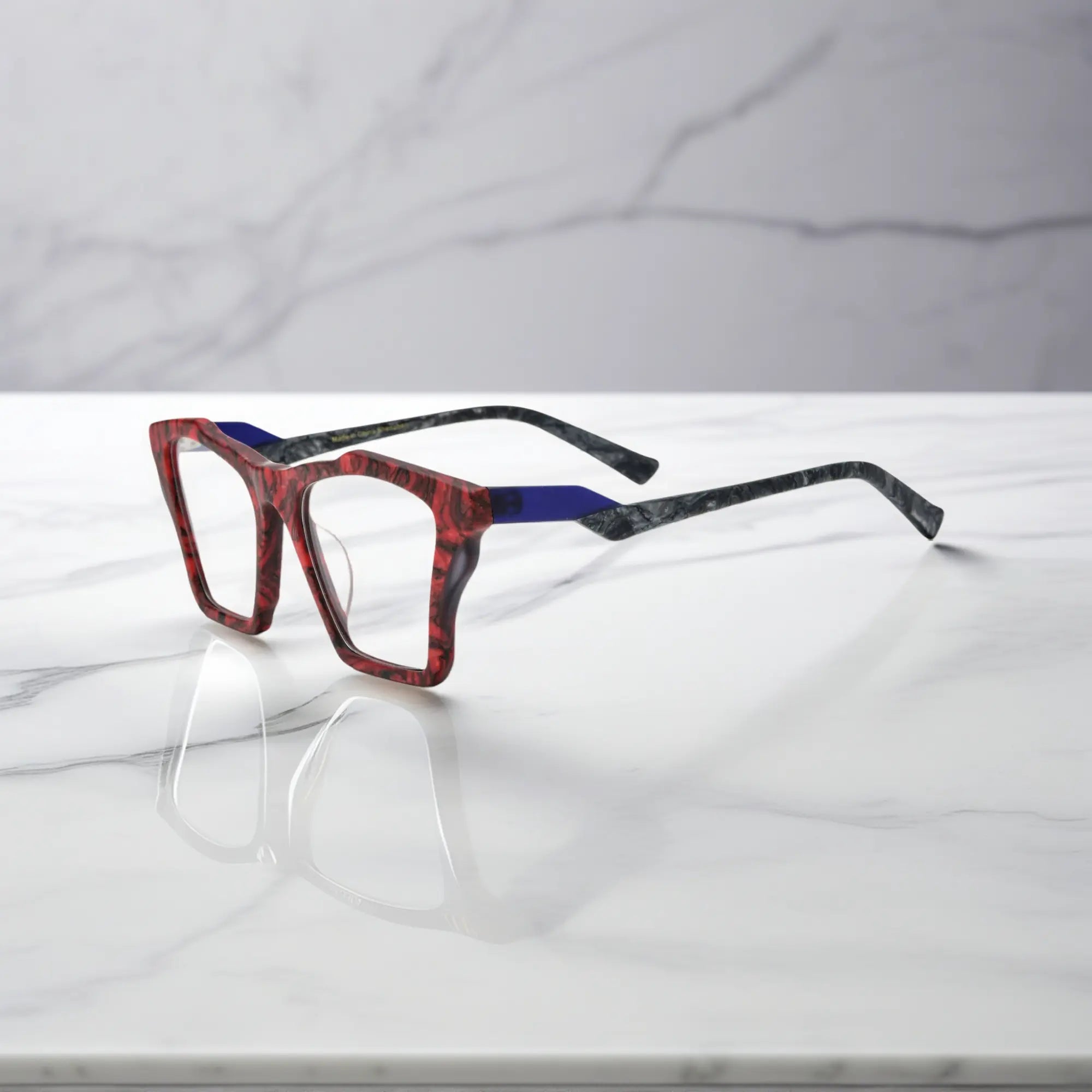 Side profile of VoyueLens™ Crimson Nebula glasses, highlighting matte crimson red with cosmic black accents and ergonomic acetate arms.