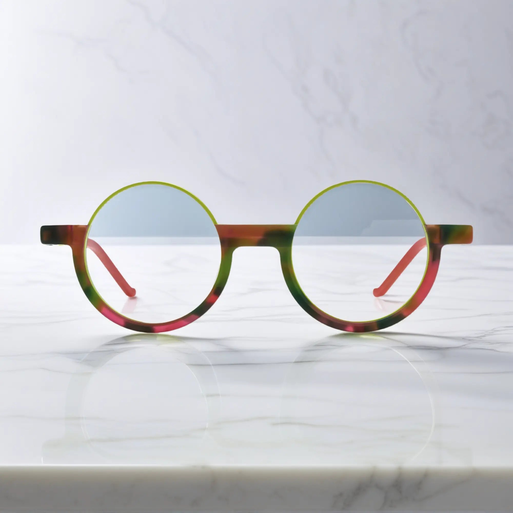 Front-facing Crimson Nebula eyeglasses in red-green blend, designed by VoyueLens™ for a cosmic statement look.