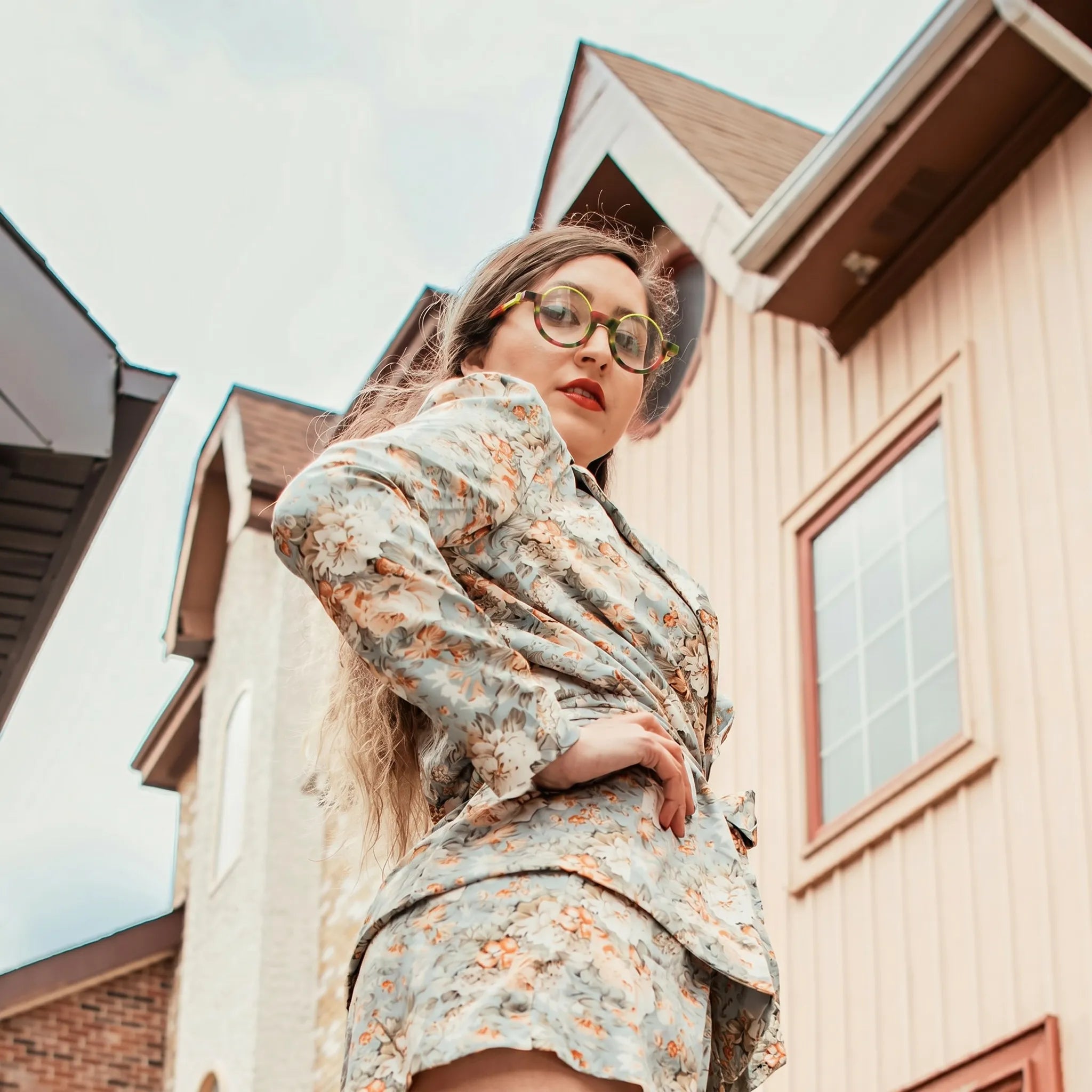 Model shot featuring Crimson Nebula VoyueLens™ eyeglasses—bold, cosmic, and full of personality.