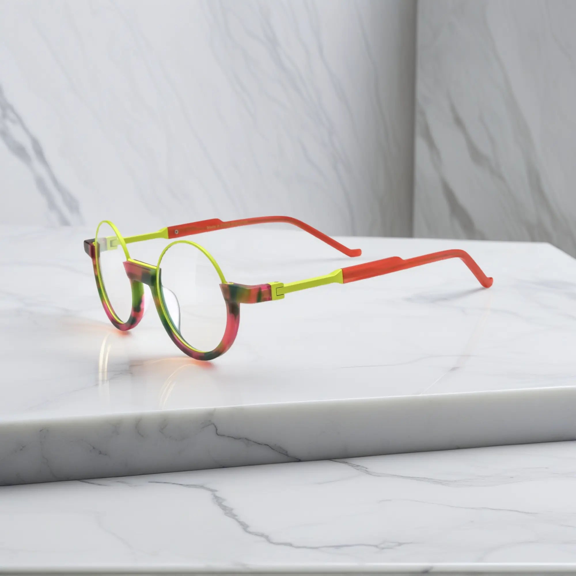 Side profile of Crimson Nebula frame showing glowing red hues transitioning into forest green.