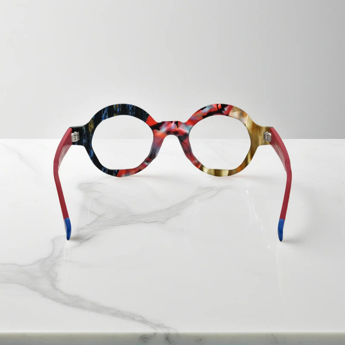 Rear perspective of Crimson Nebula glasses highlighting cosmic-inspired frame details and matte finish